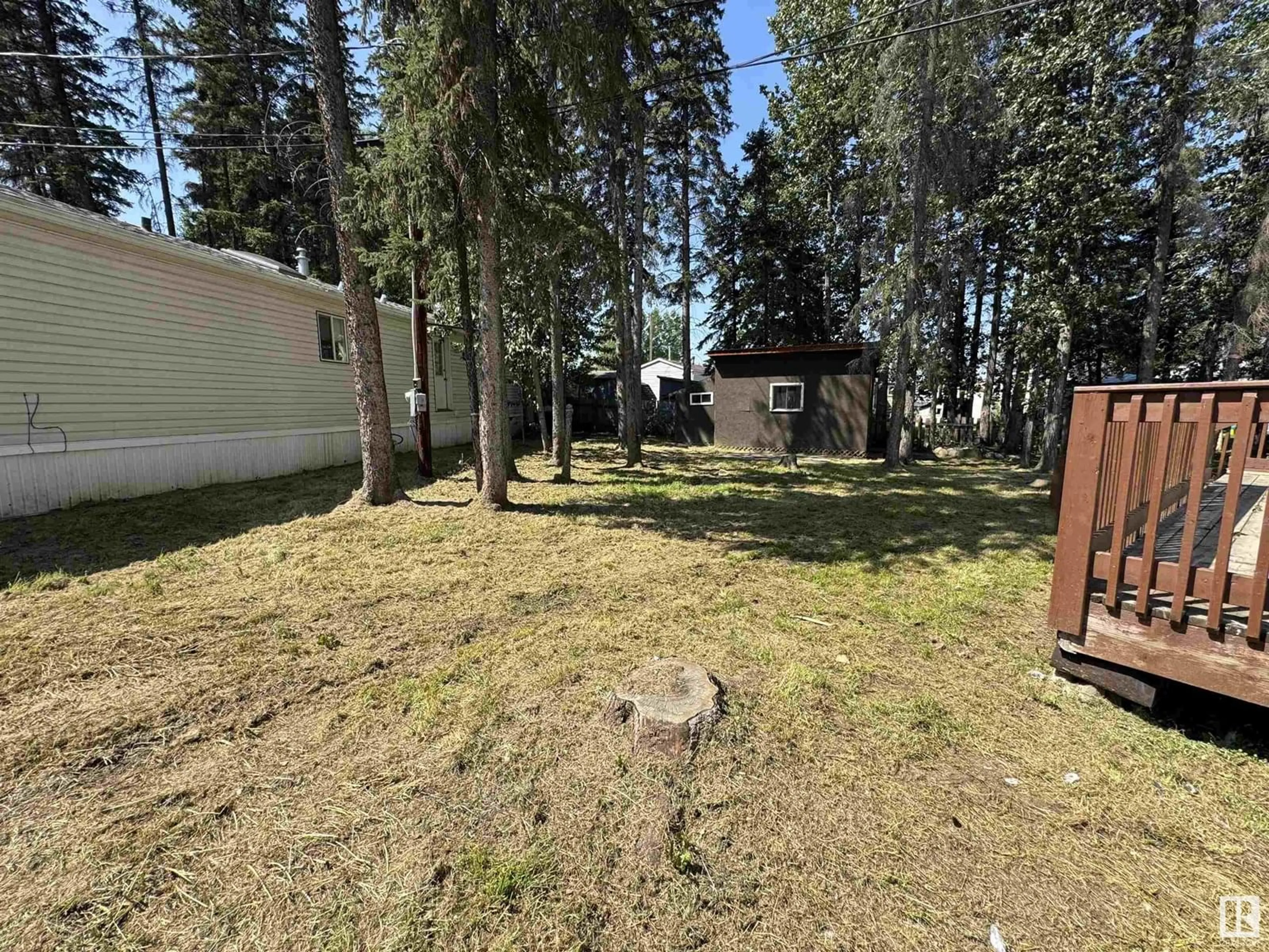 A pic from outside/outdoor area/front of a property/back of a property/a pic from drone, forest/trees view for 5002 56ave - 60 GREENWOOD MHP, Drayton Valley Alberta T7A1M6