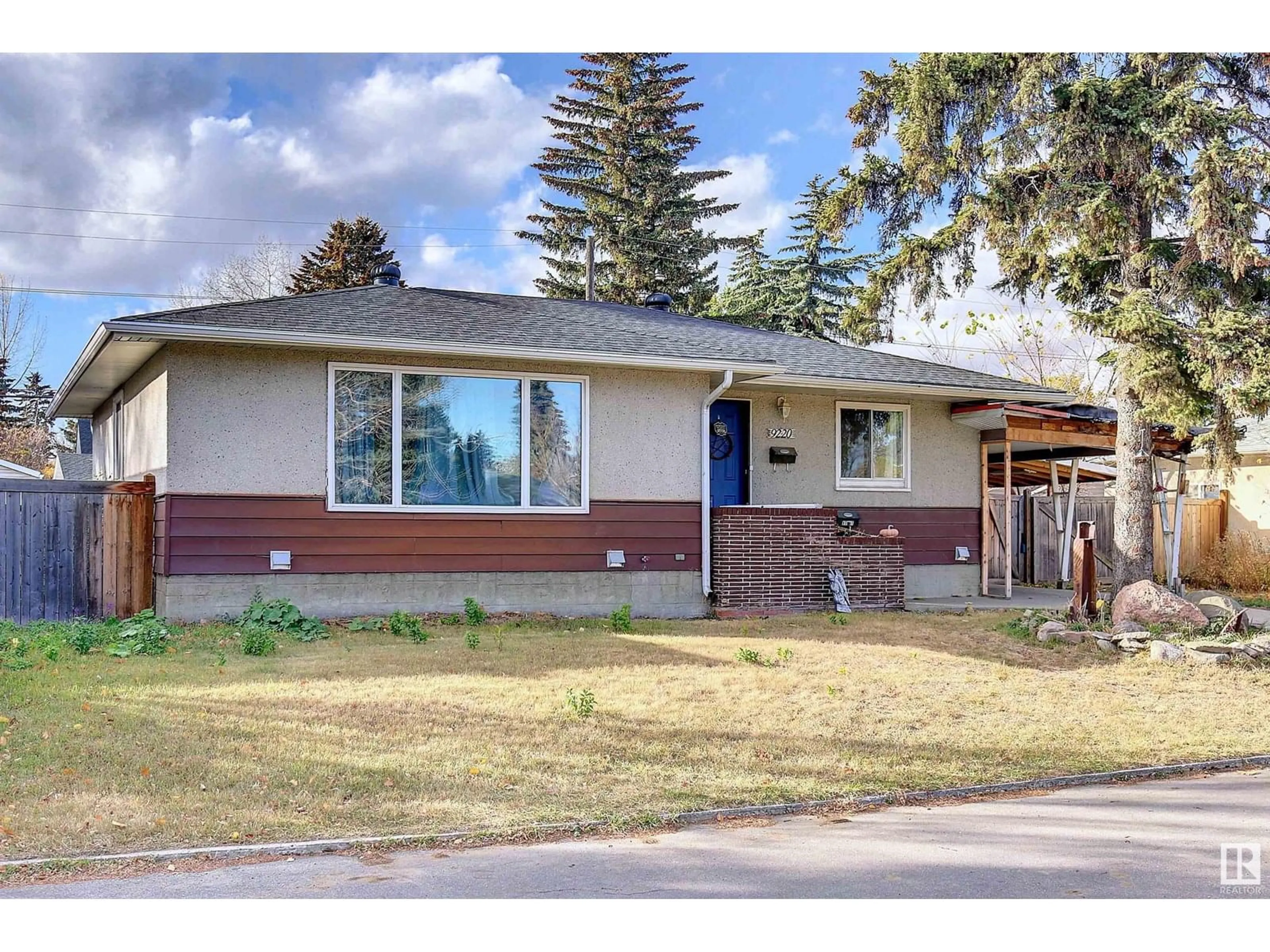 Home with vinyl exterior material, street for 9220 75 ST, Edmonton Alberta T6C2H4