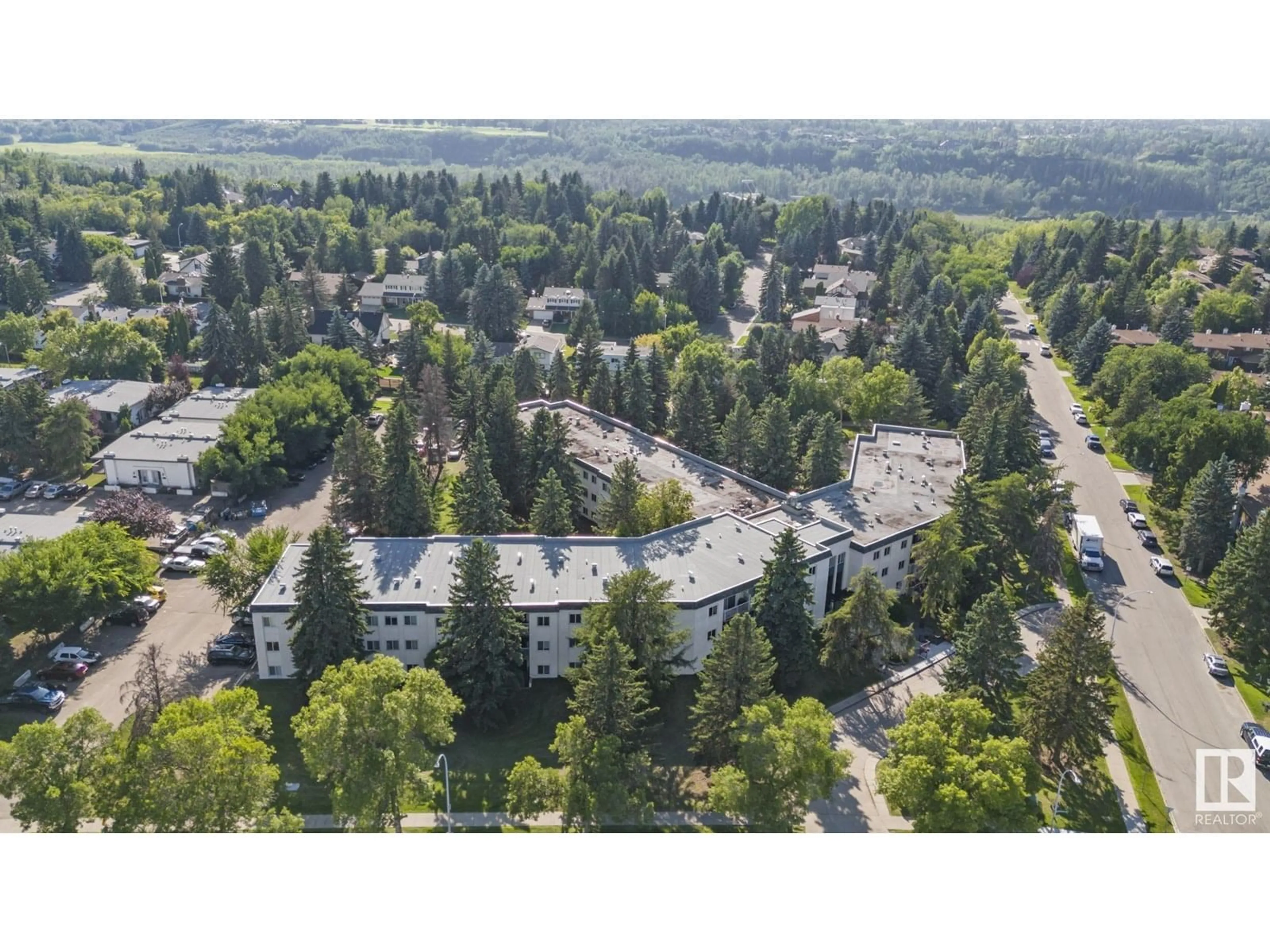 A pic from outside/outdoor area/front of a property/back of a property/a pic from drone, forest/trees view for #223 - 5730 RIVERBEND RD, Edmonton Alberta T6H4T4