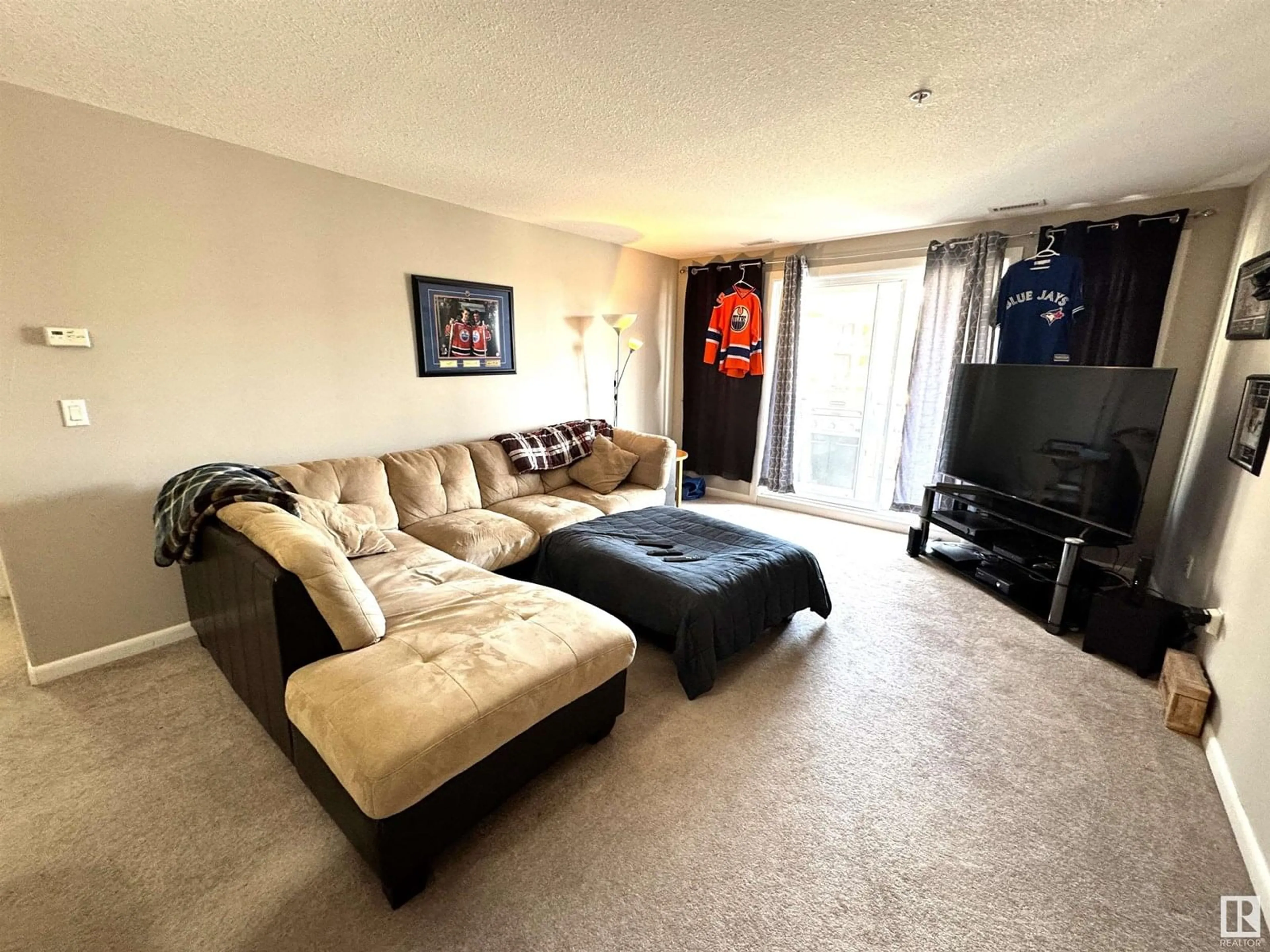 Living room with furniture, unknown for 300 - 333 PALISADES WAY, Sherwood Park Alberta T8H2T9