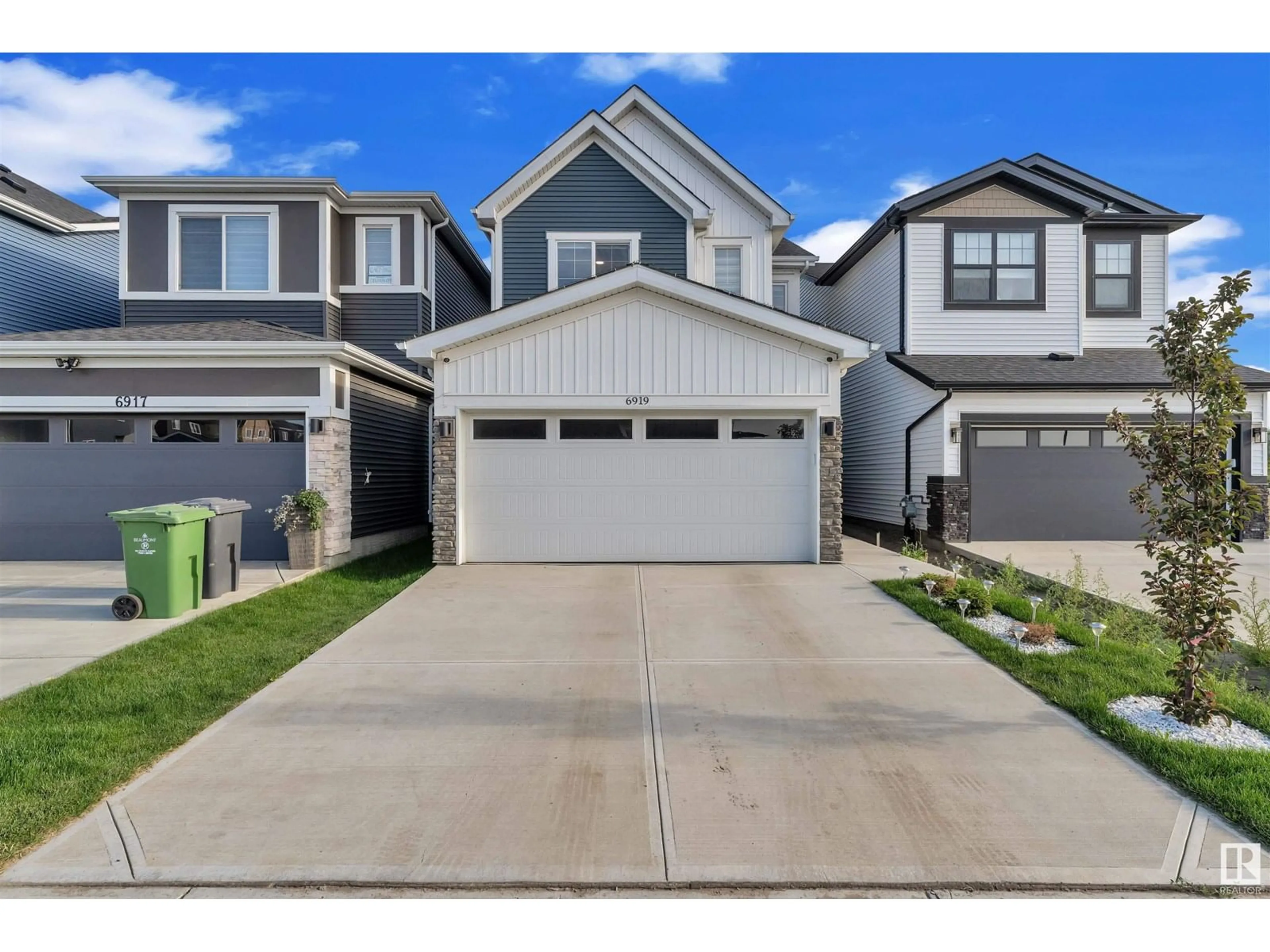 Home with vinyl exterior material, street for 6919 54 AV, Beaumont Alberta T4X2Z7