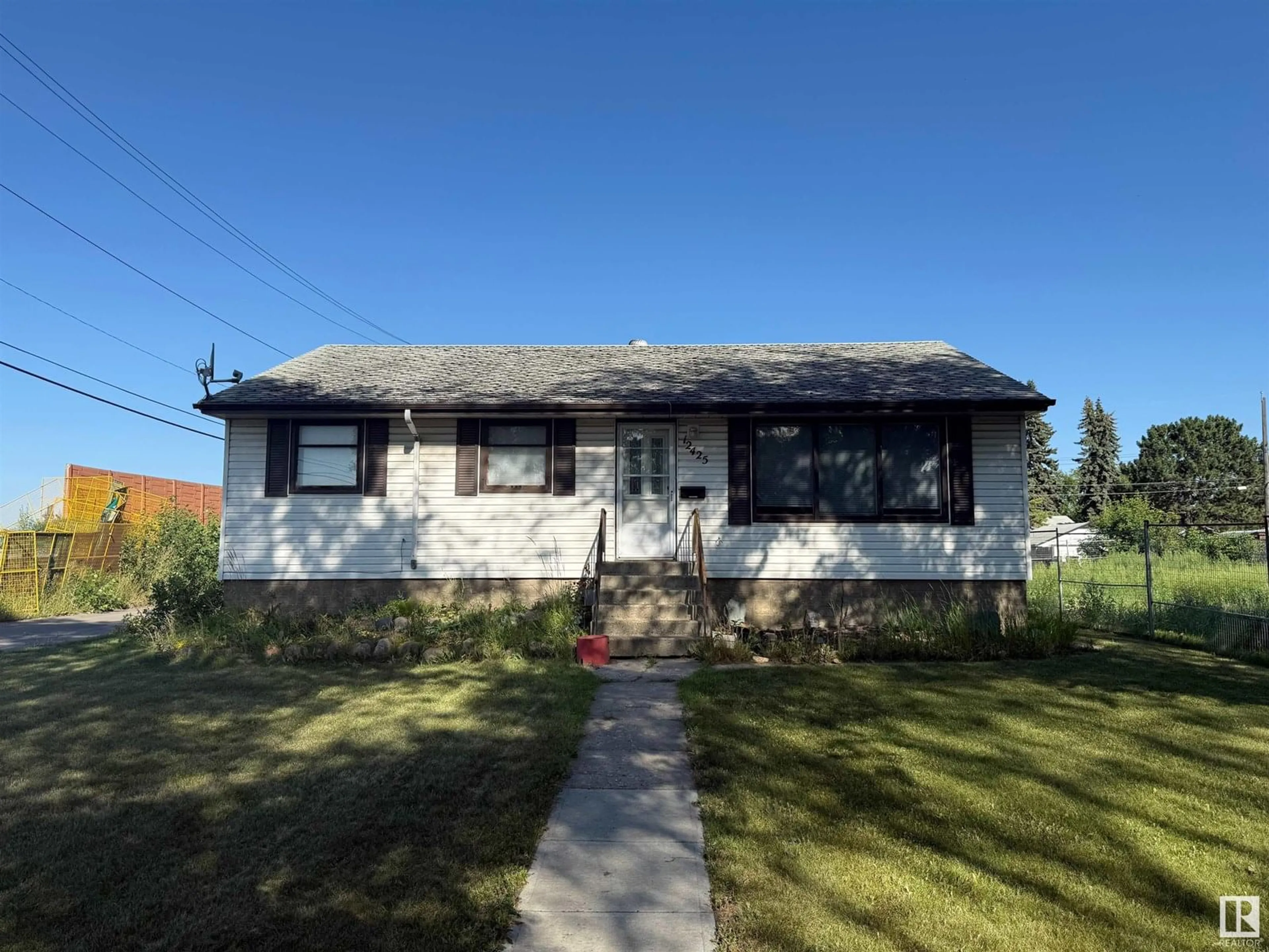 Home with vinyl exterior material, street for NW - 12425 126 ST, Edmonton Alberta T5L0X2