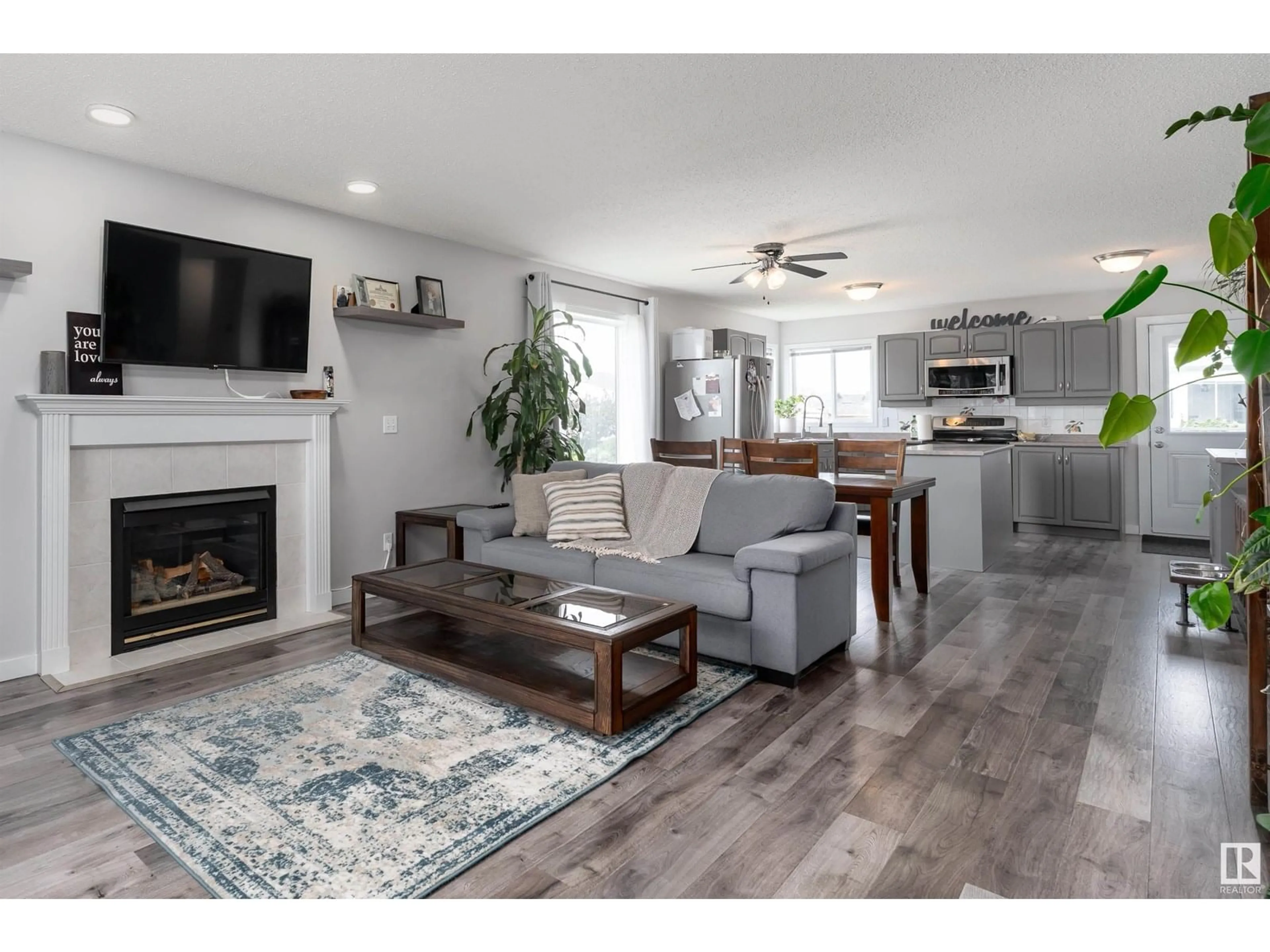 Living room with furniture, wood/laminate floor for 9917 94 ST, Fort Saskatchewan Alberta T8L4J5