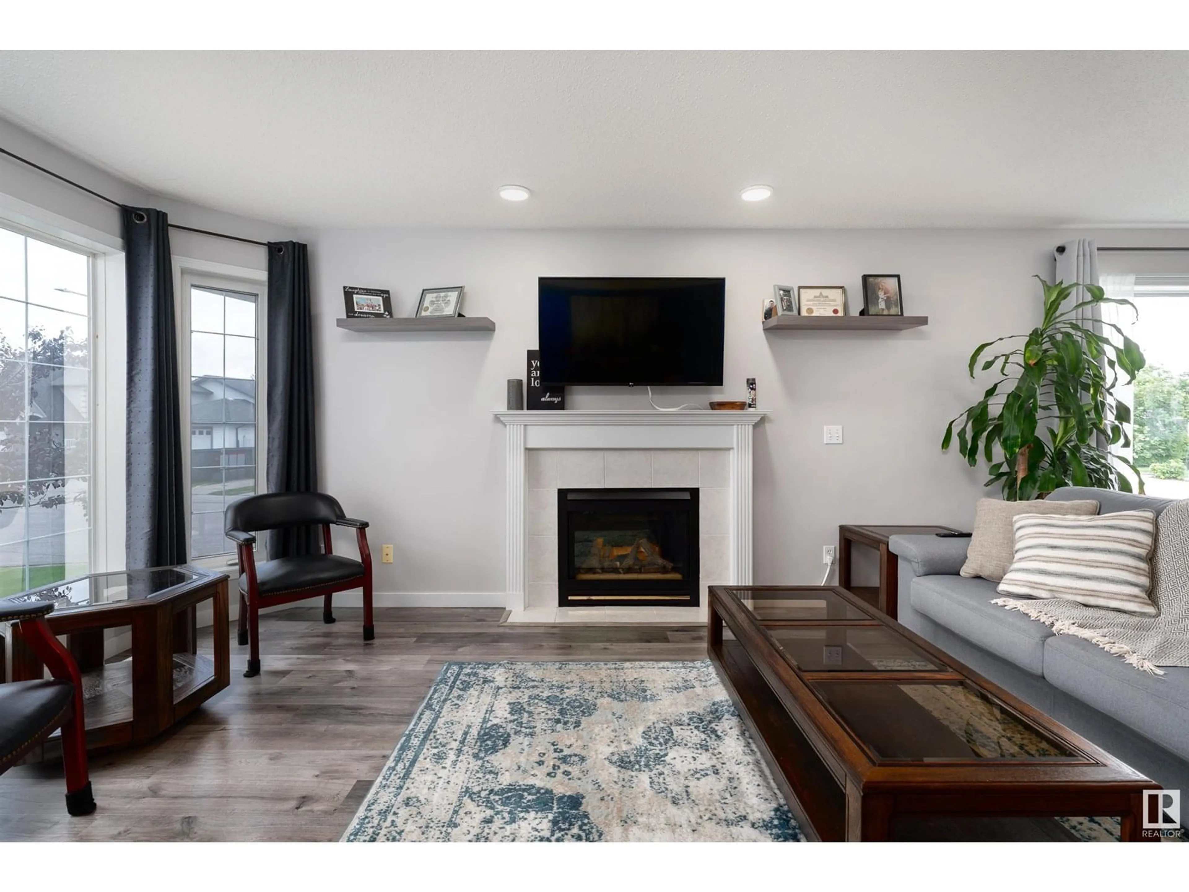 Living room with furniture, wood/laminate floor for 9917 94 ST, Fort Saskatchewan Alberta T8L4J5