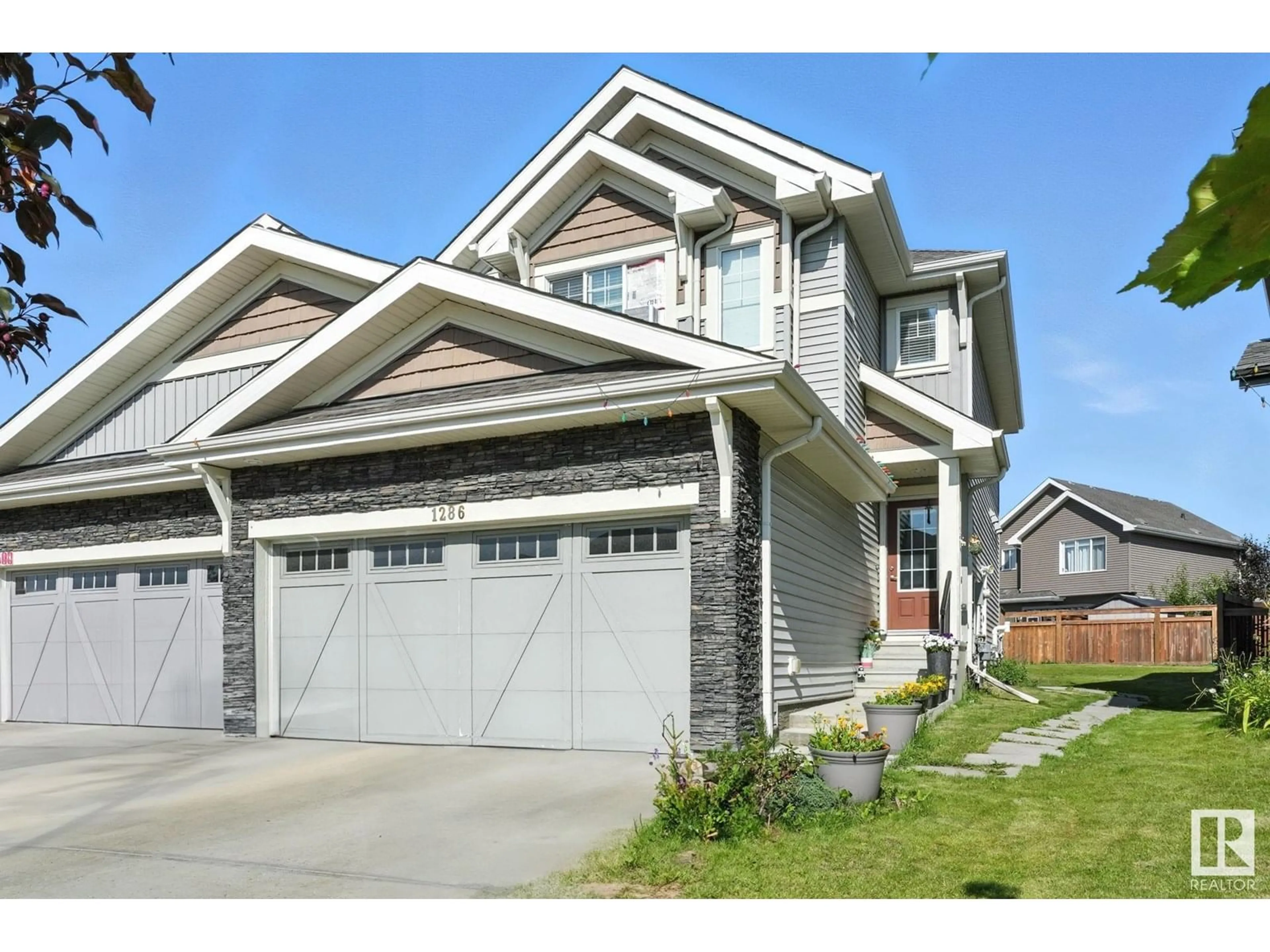 Home with vinyl exterior material, street for 1286 DANIELS CR, Edmonton Alberta T6W3J1