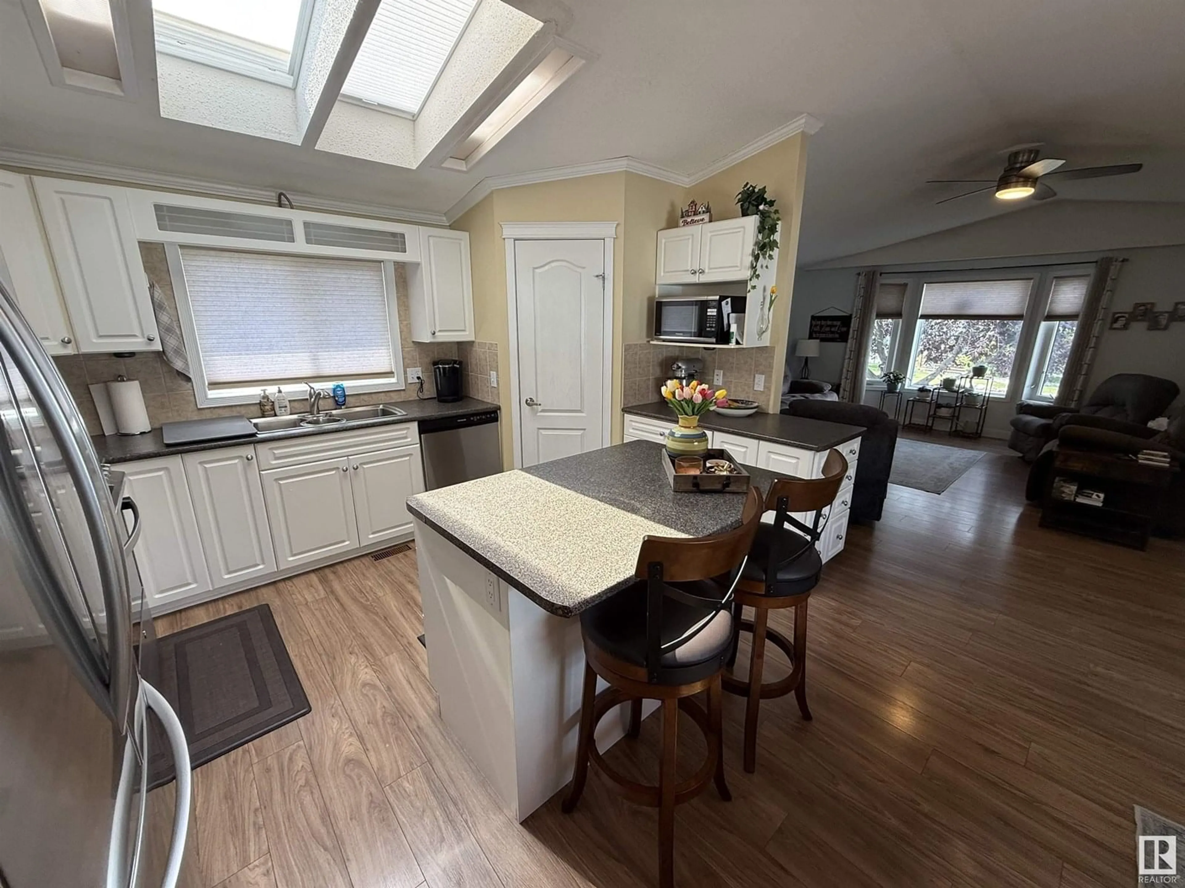 Open concept kitchen, wood/laminate floor for 1771 JUBILEE LO, Sherwood Park Alberta T8H2M9