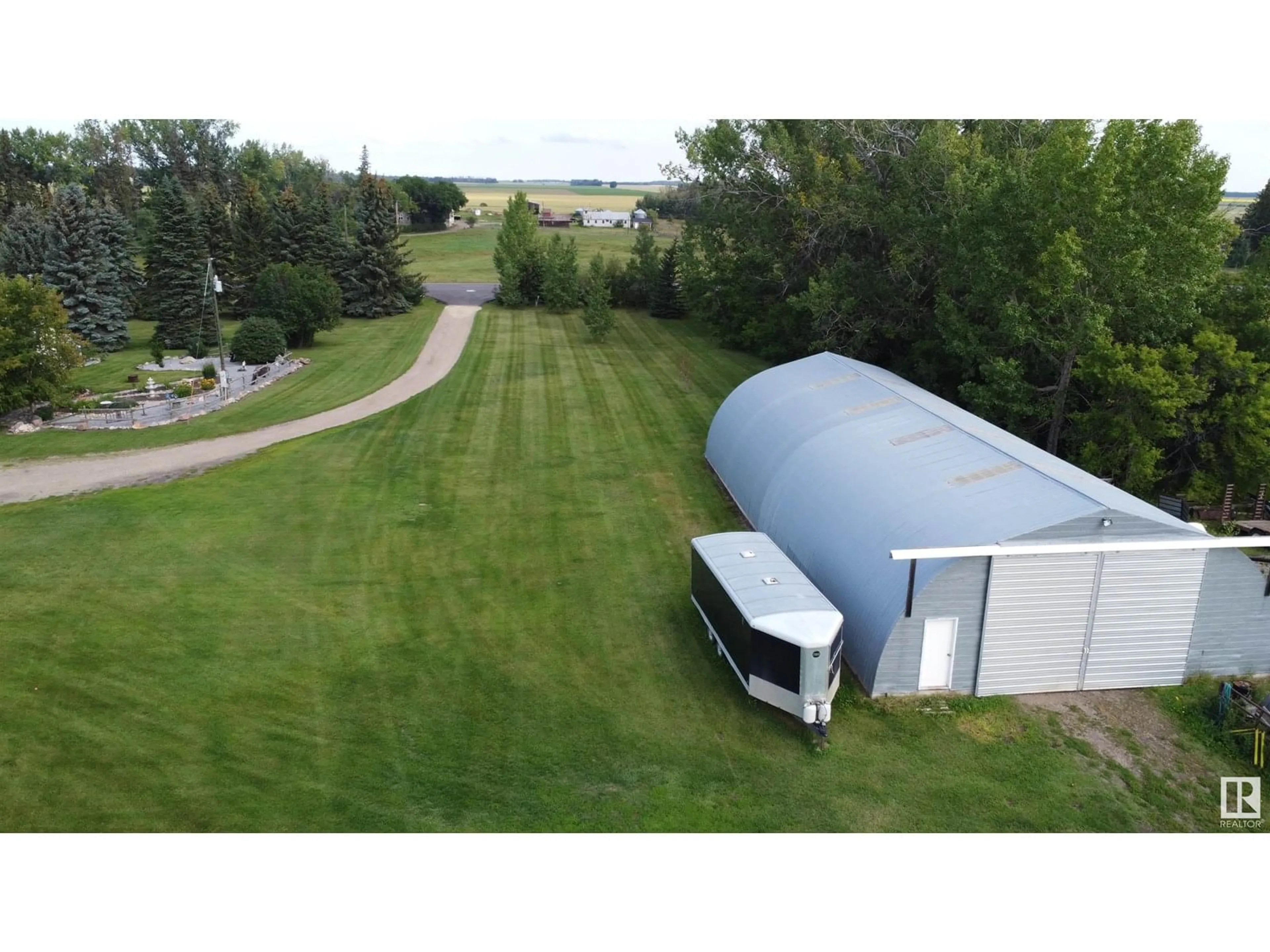A pic from outside/outdoor area/front of a property/back of a property/a pic from drone, water/lake/river/ocean view for 26449 TWP RD 490, Rural Leduc County Alberta T0C0V0