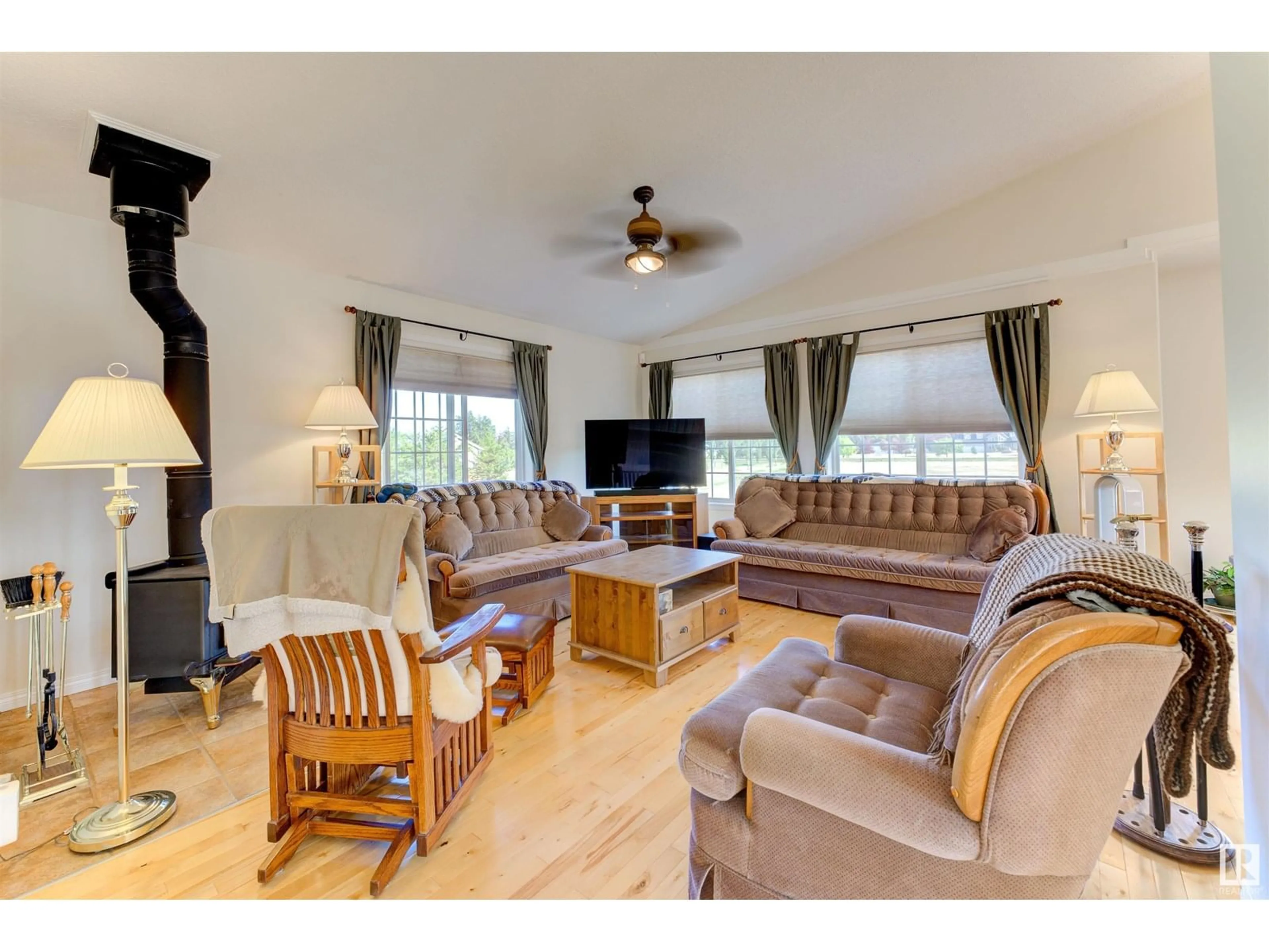 Living room with furniture, wood/laminate floor for 63319 - 28 RANGE ROAD 435, Rural Bonnyville M.D. Alberta T9M1P3
