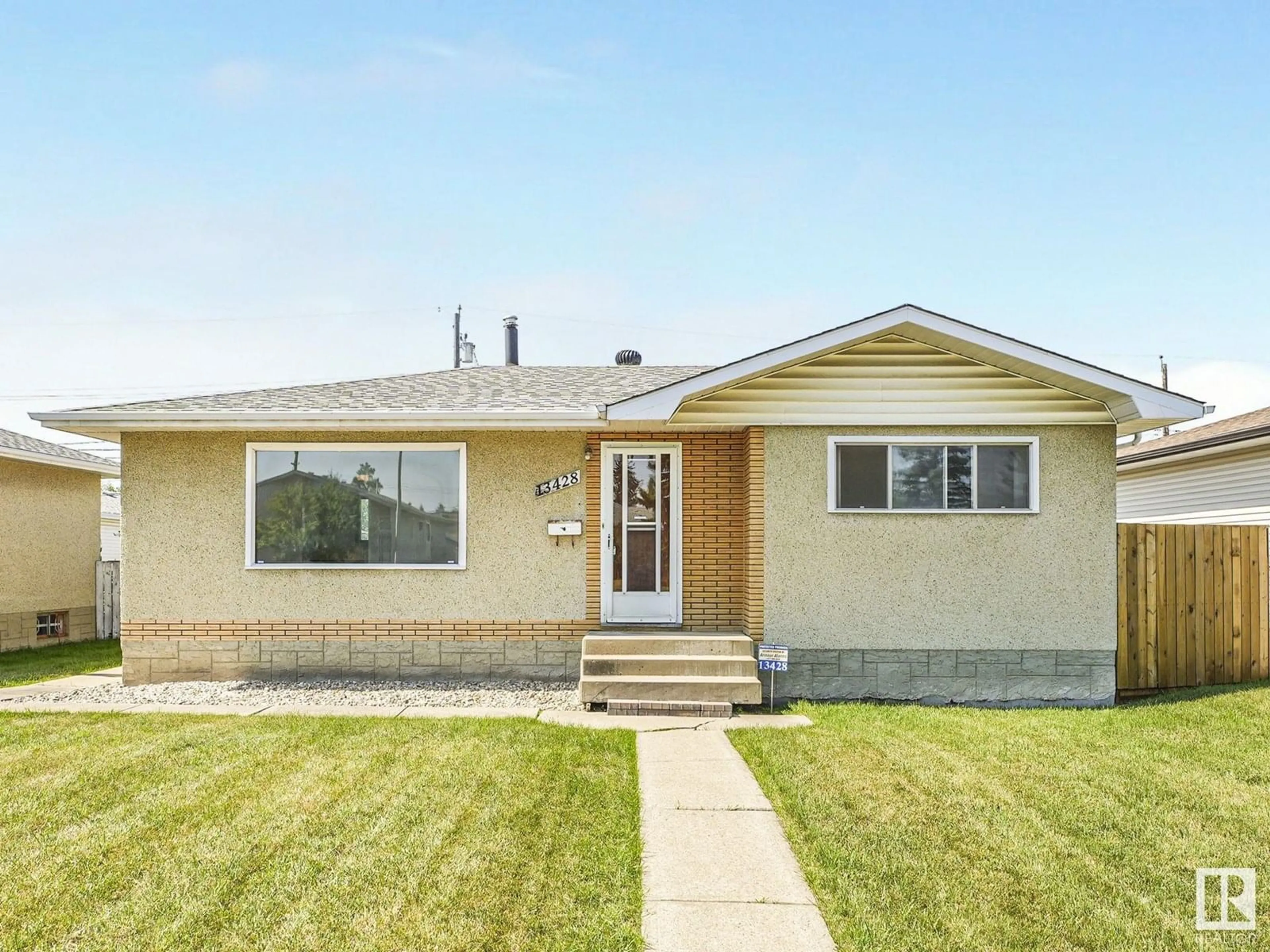 Home with vinyl exterior material, street for 13428 66 ST, Edmonton Alberta T5C0B6