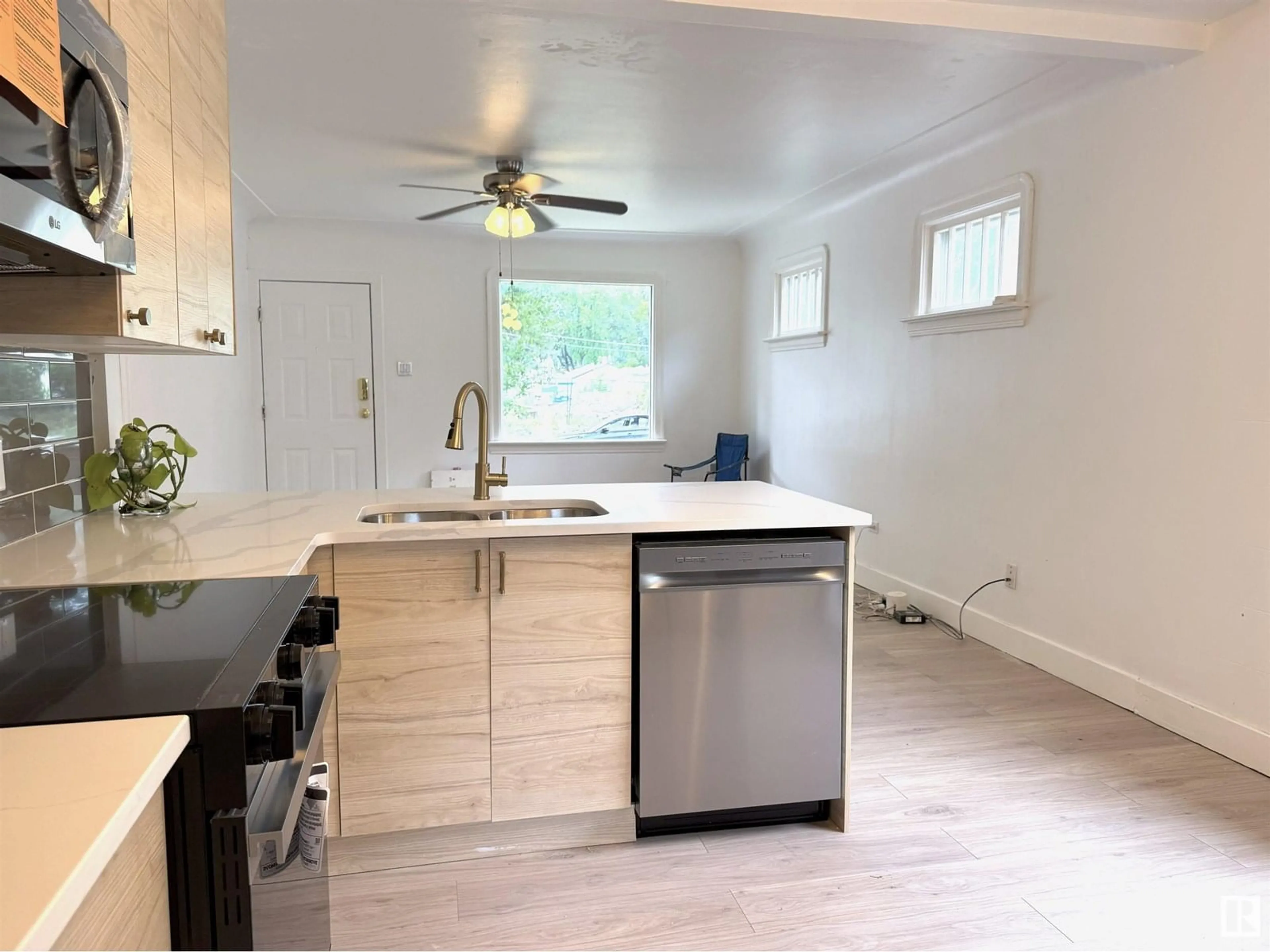 Open concept kitchen, wood/laminate floor for 11840 70 ST, Edmonton Alberta T5B1T7
