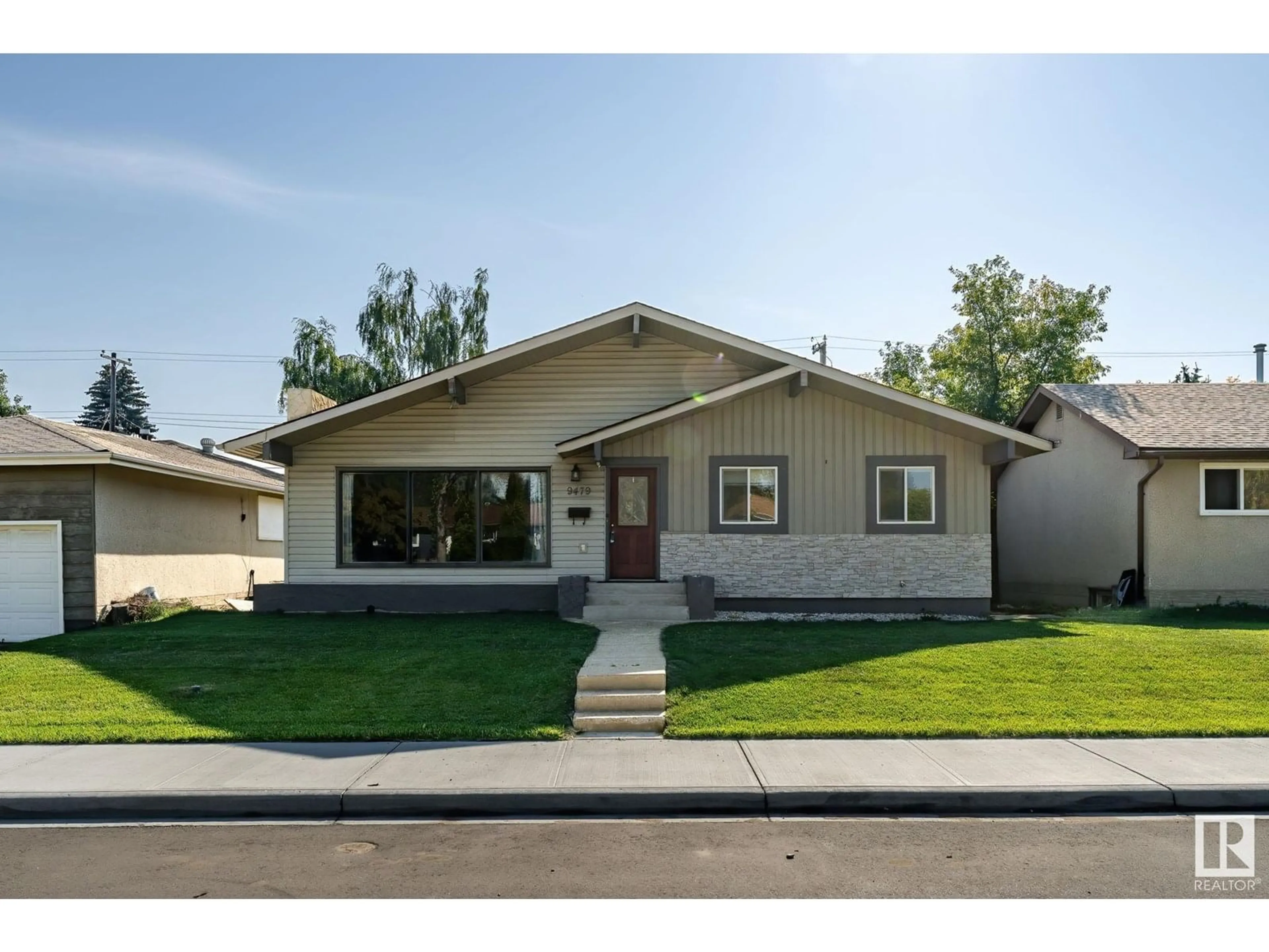 Home with vinyl exterior material, street for 9479 75 ST, Edmonton Alberta T6C4H6