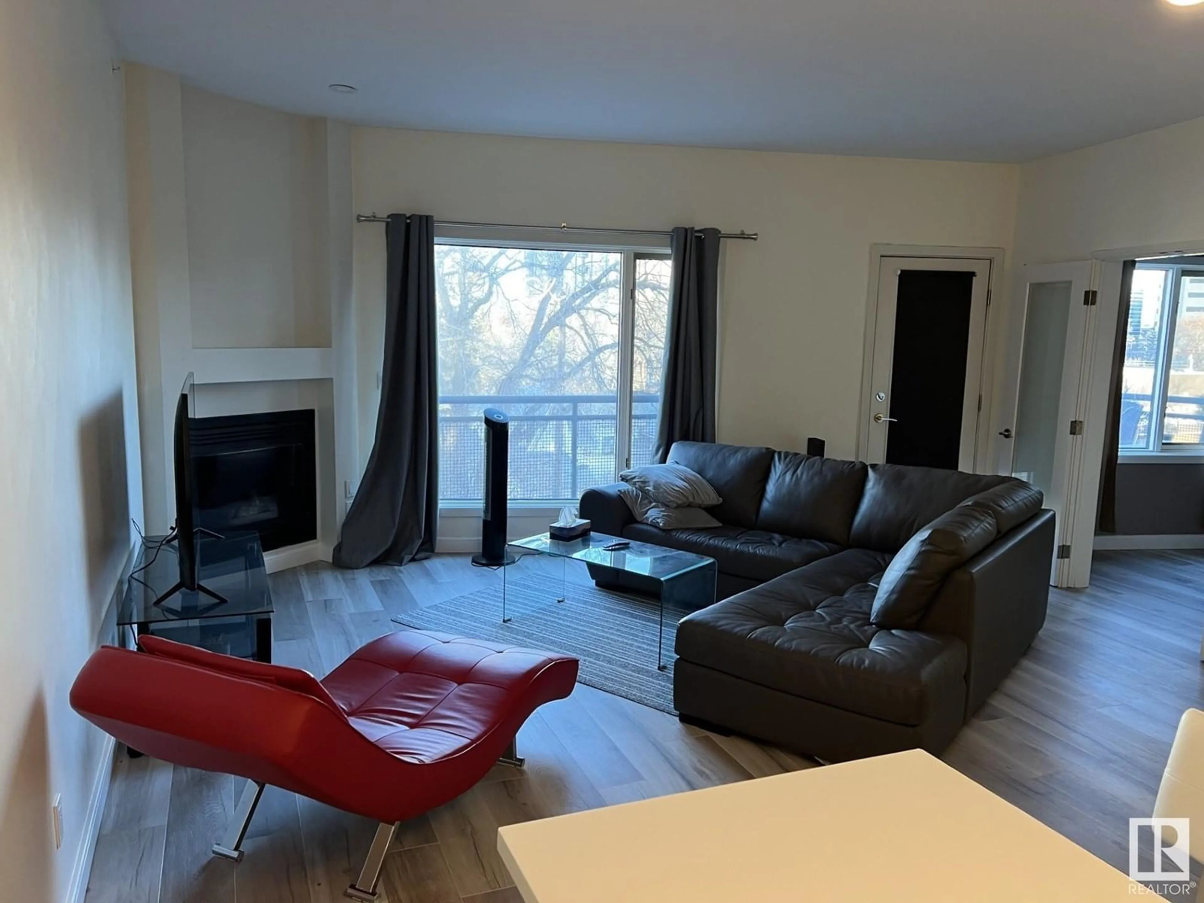 Living room with furniture, wood/laminate floor for #405 - 11415 100 AV, Edmonton Alberta T5K0J5