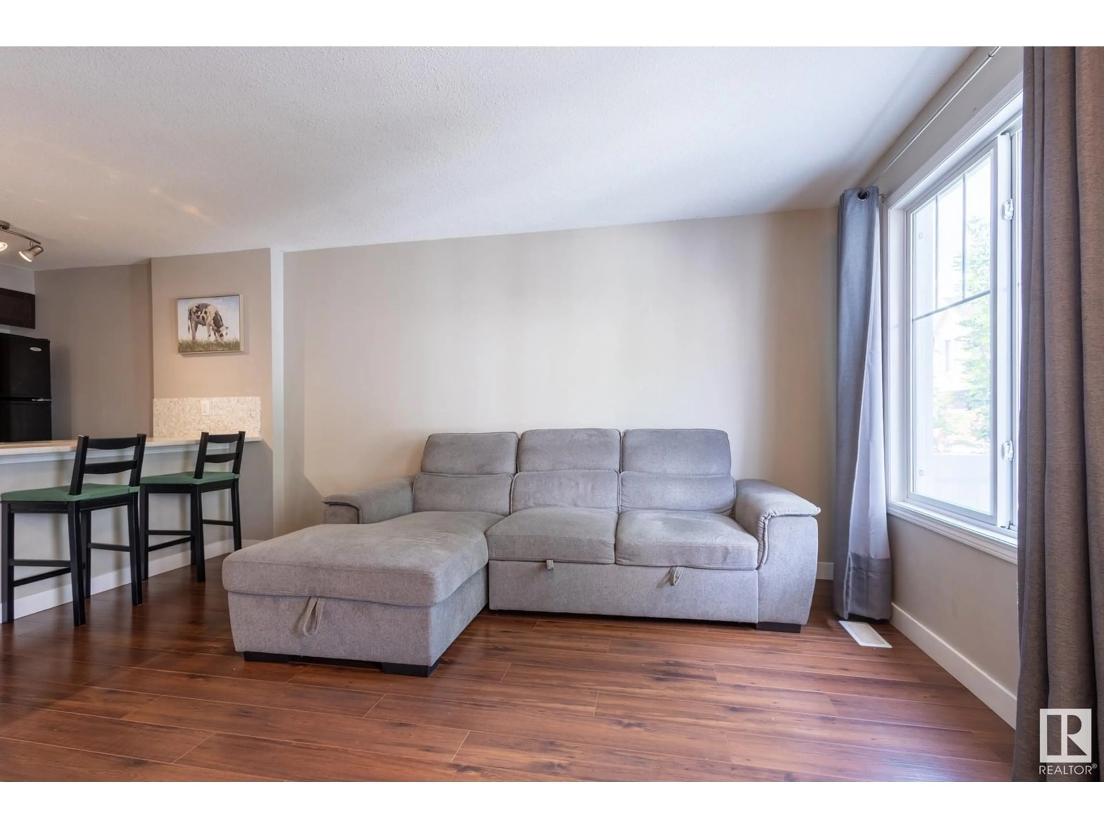 Living room with furniture, wood/laminate floor for 34 - 1623 TOWNE CENTRE BV, Edmonton Alberta T6R0S3