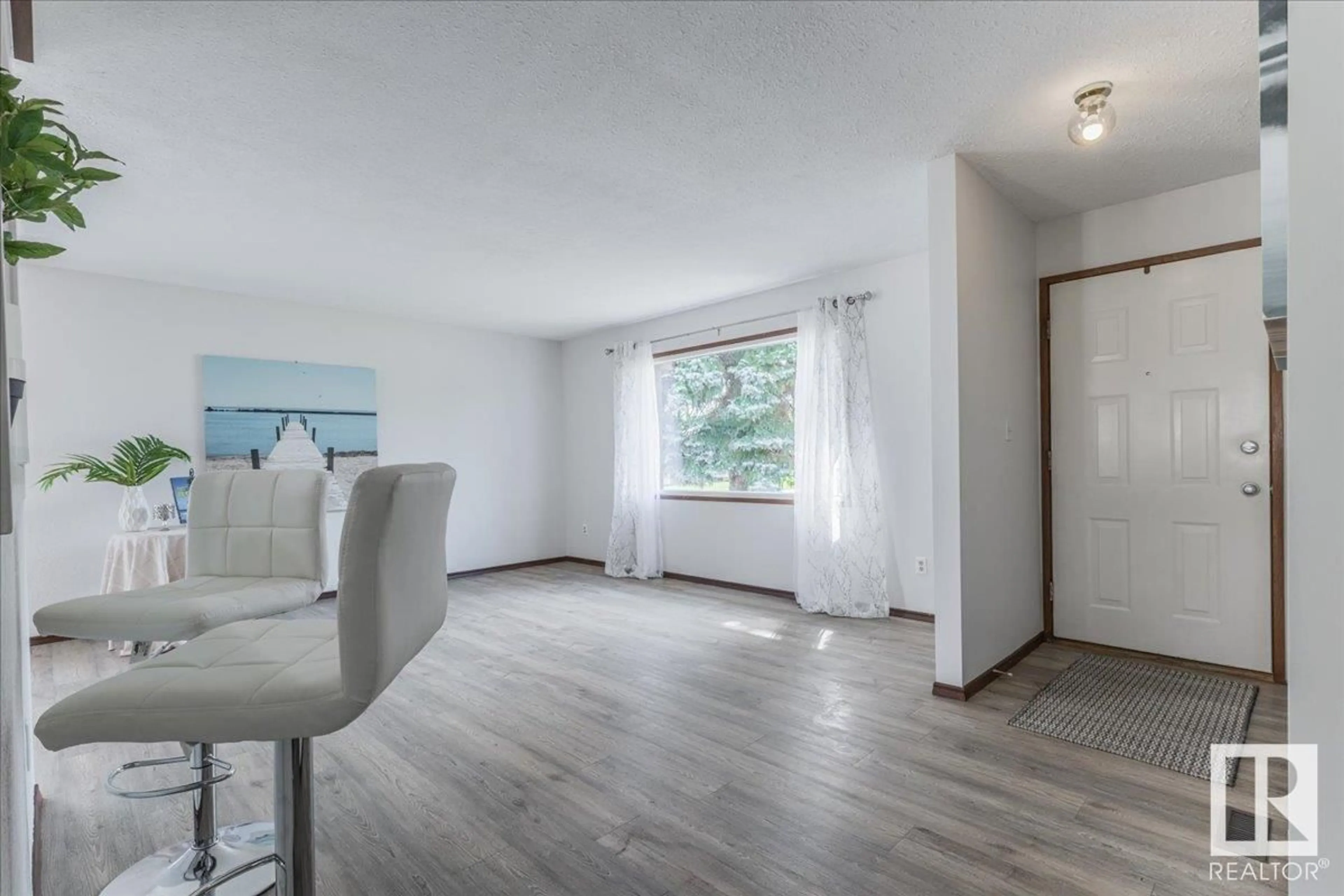 Living room with furniture, wood/laminate floor for 5782 GARDEN MEADOWS DR, Wetaskiwin Alberta T9A2L6