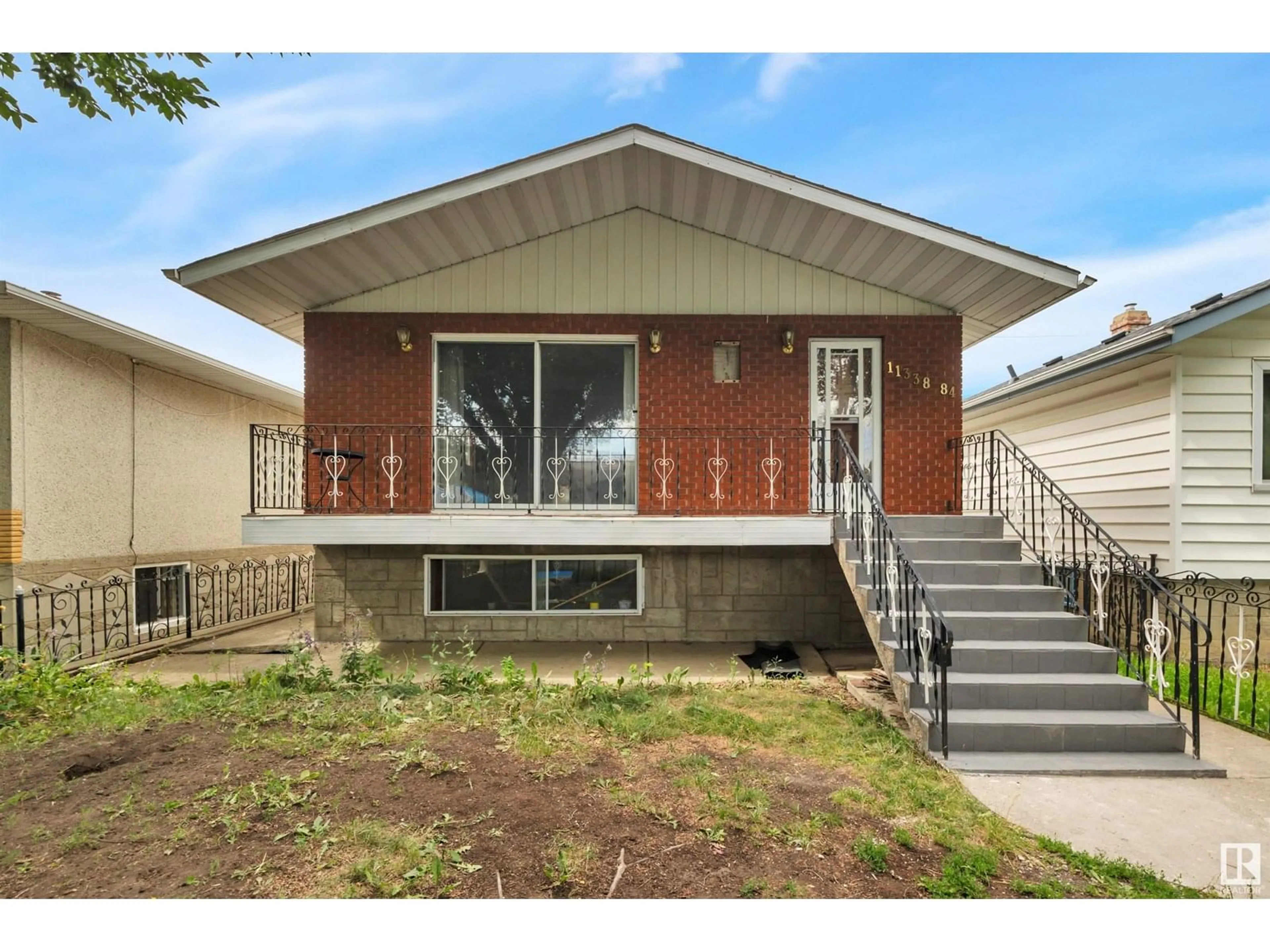 Home with brick exterior material, street for NW - 11338 84 ST, Edmonton Alberta T5B3B2