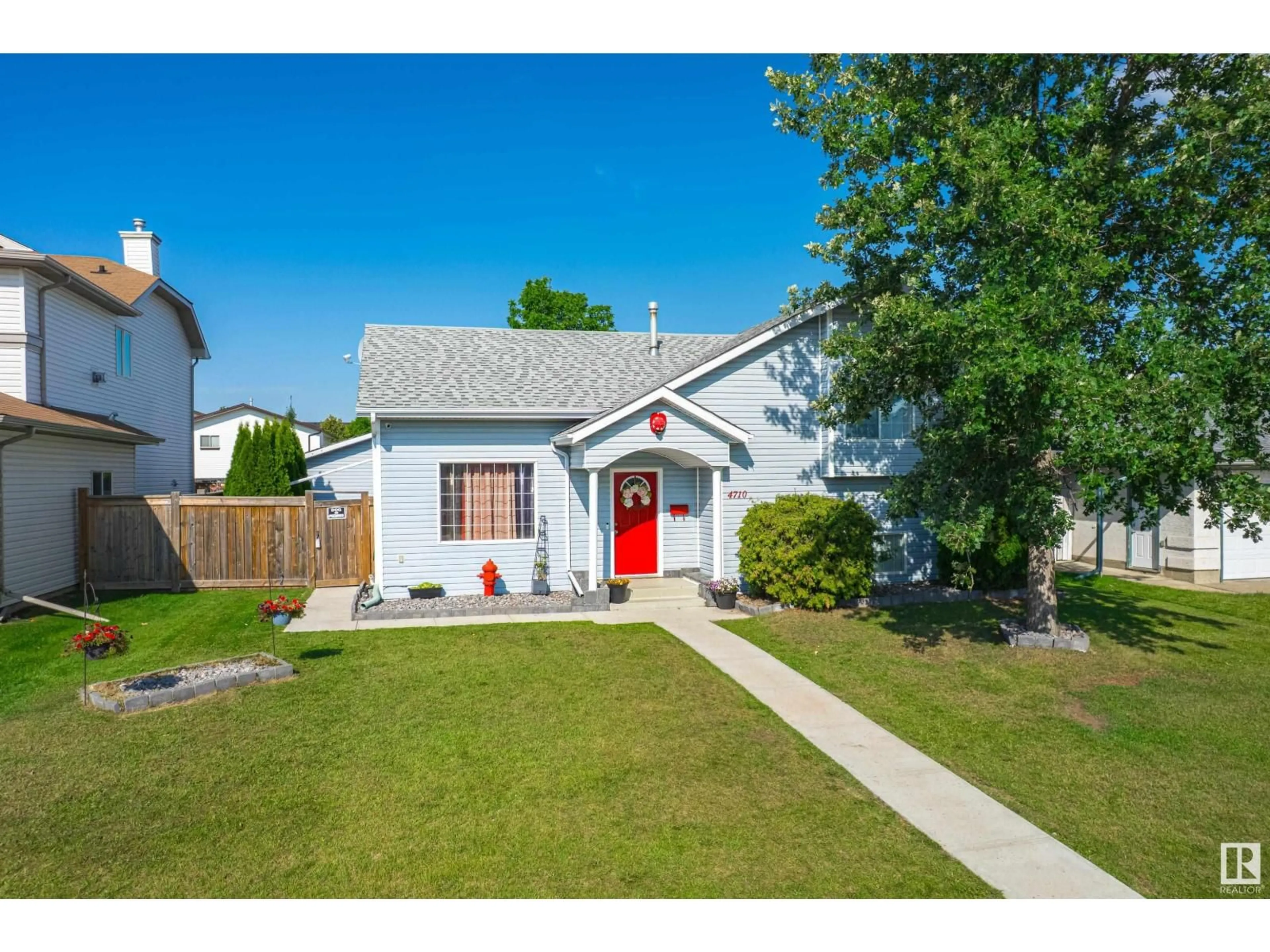 Home with vinyl exterior material, street for 4710 47 ST, Legal Alberta T0G1L0
