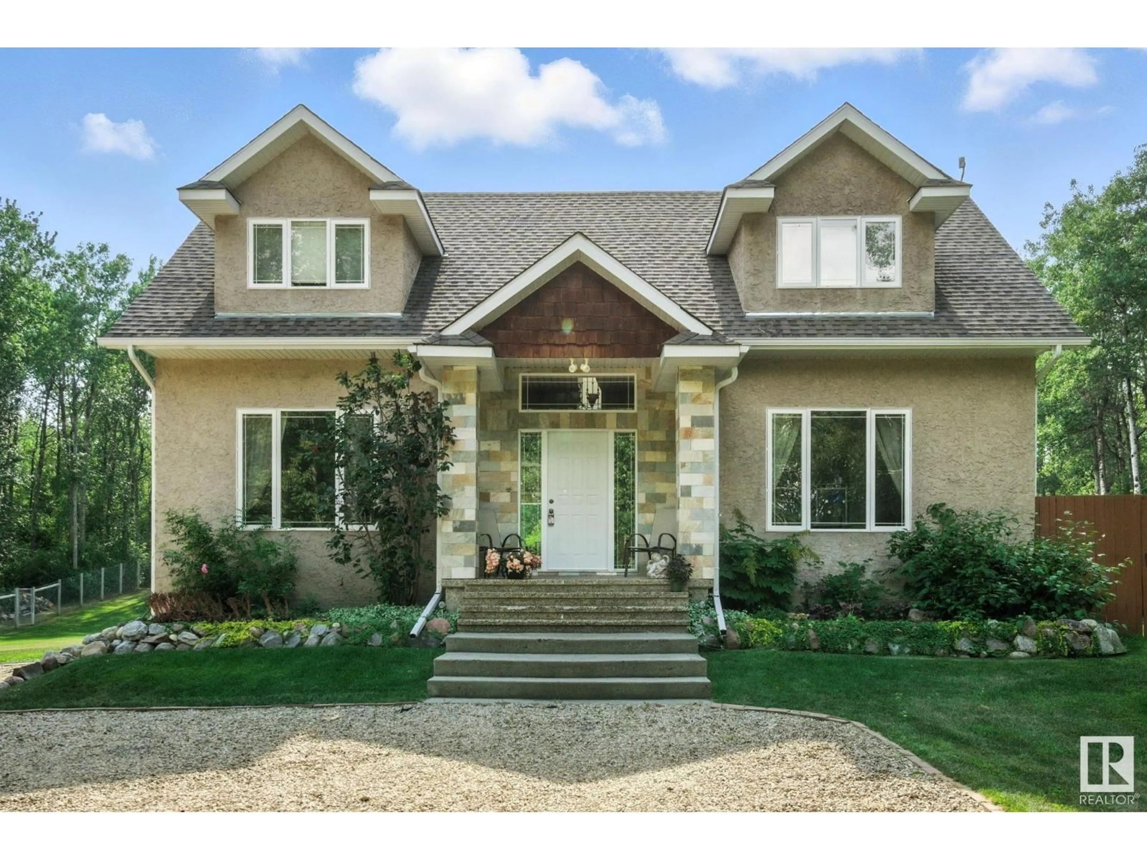 Home with vinyl exterior material, street for 54422 - 17 RGE ROAD 13, Rural Lac Ste. Anne County Alberta T0E1V2