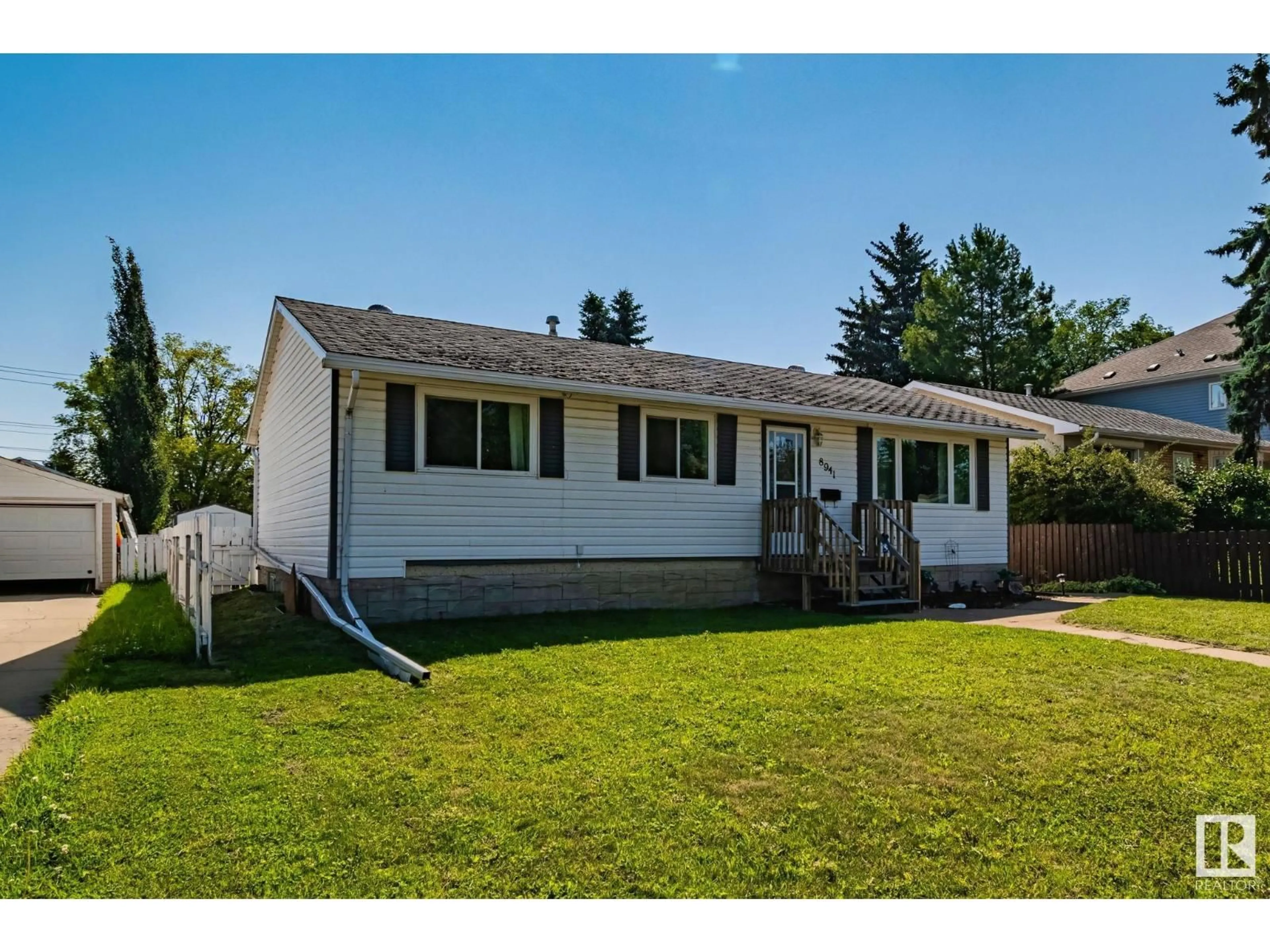 Home with vinyl exterior material, street for 8941 155 ST, Edmonton Alberta T5R1W3
