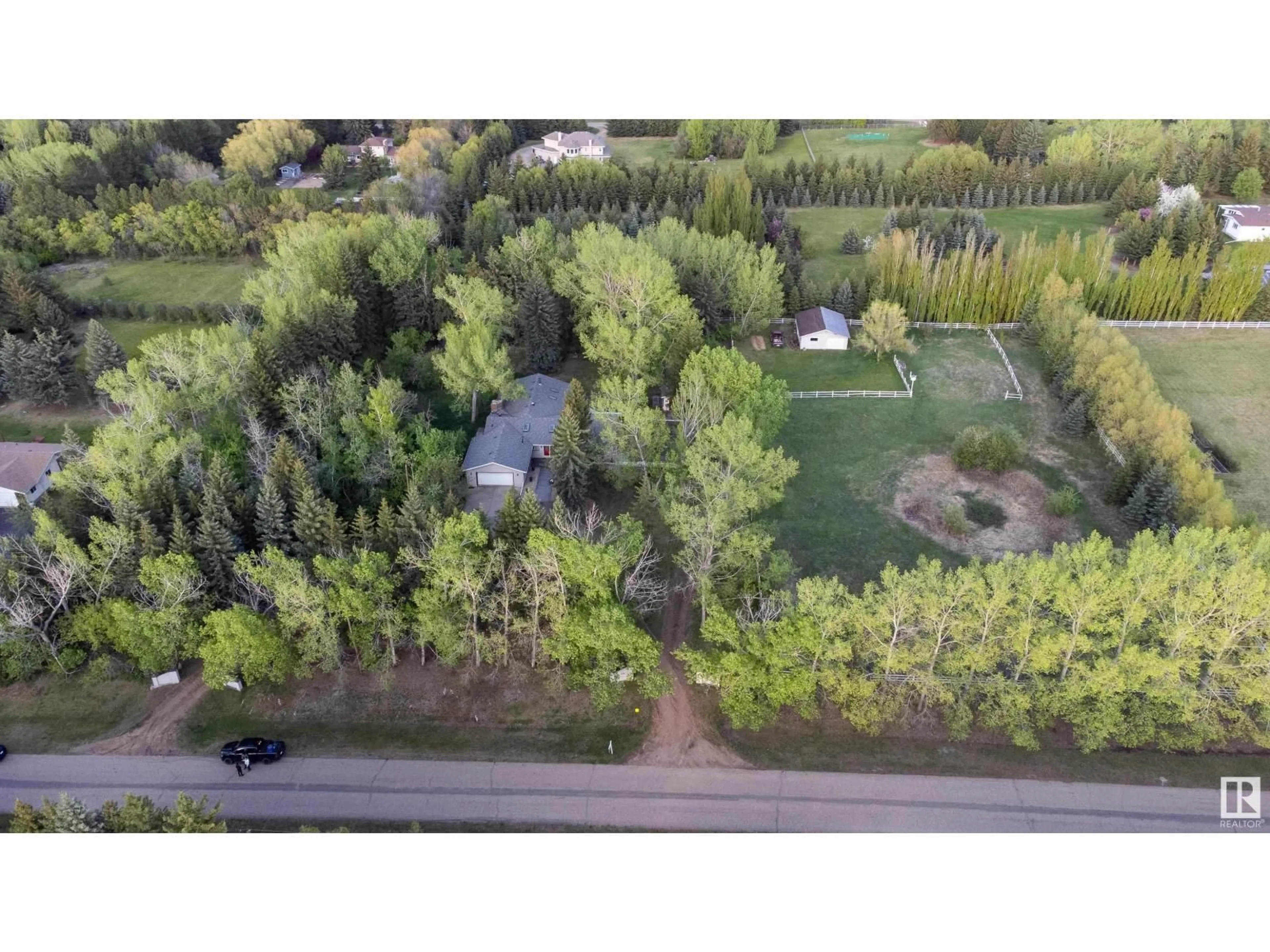 A pic from outside/outdoor area/front of a property/back of a property/a pic from drone, forest/trees view for 52552 224 - 134 RANGE RD, Rural Strathcona County Alberta T8A4R7