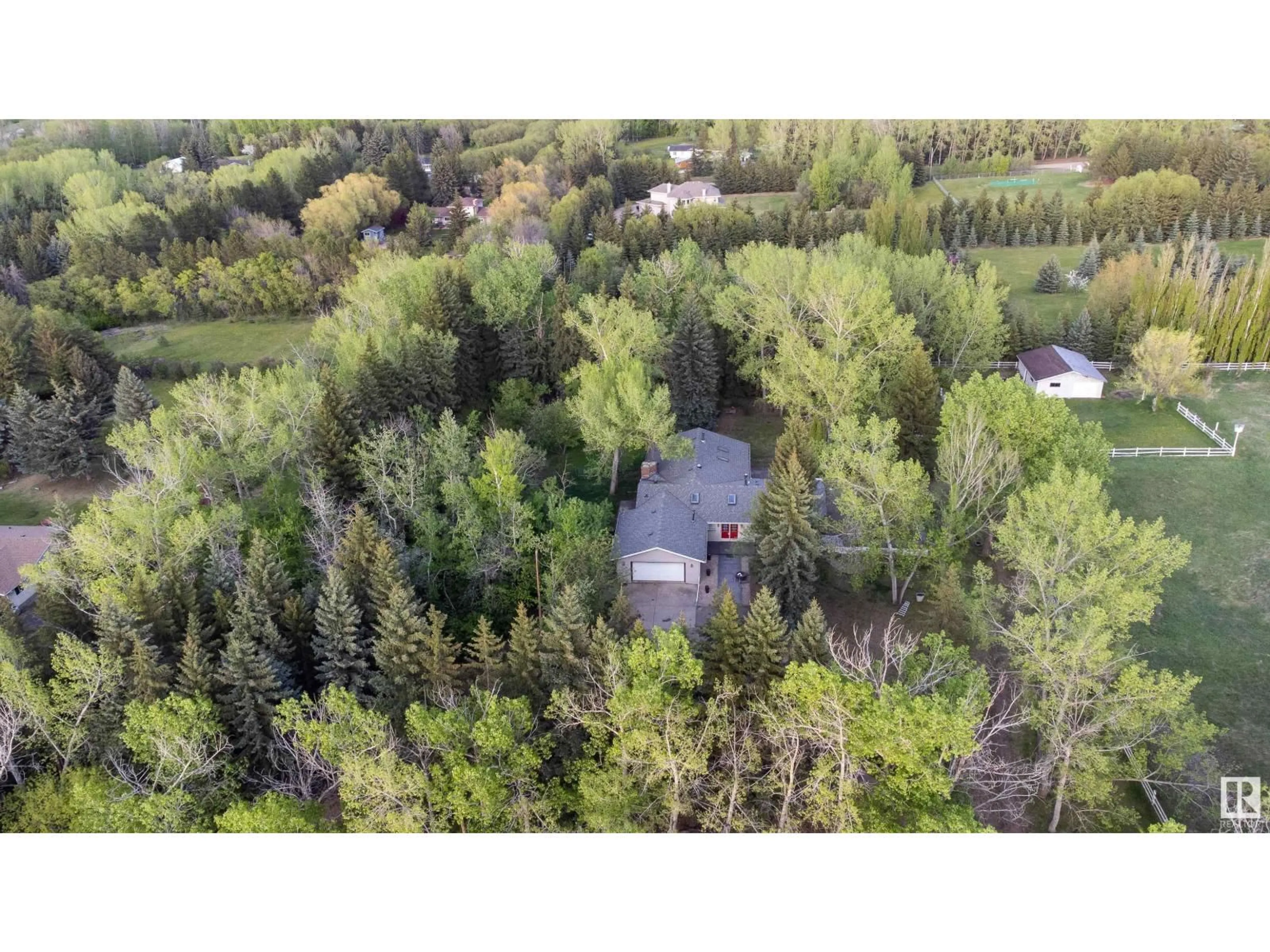 A pic from outside/outdoor area/front of a property/back of a property/a pic from drone, forest/trees view for 52552 224 - 134 RANGE RD, Rural Strathcona County Alberta T8A4R7