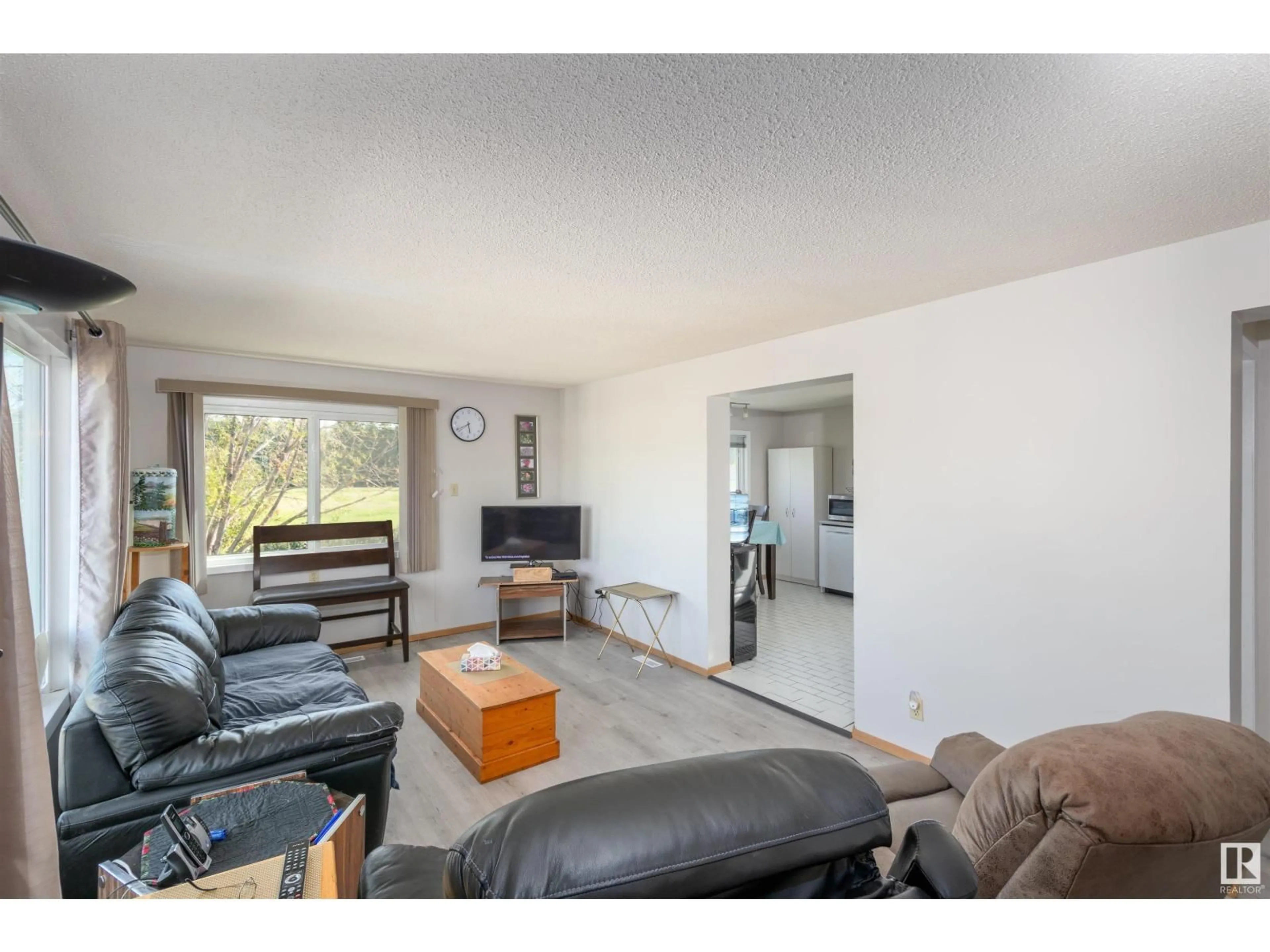 Living room with furniture, wood/laminate floor for 4708 52 ST, Onoway Alberta T0E1V0