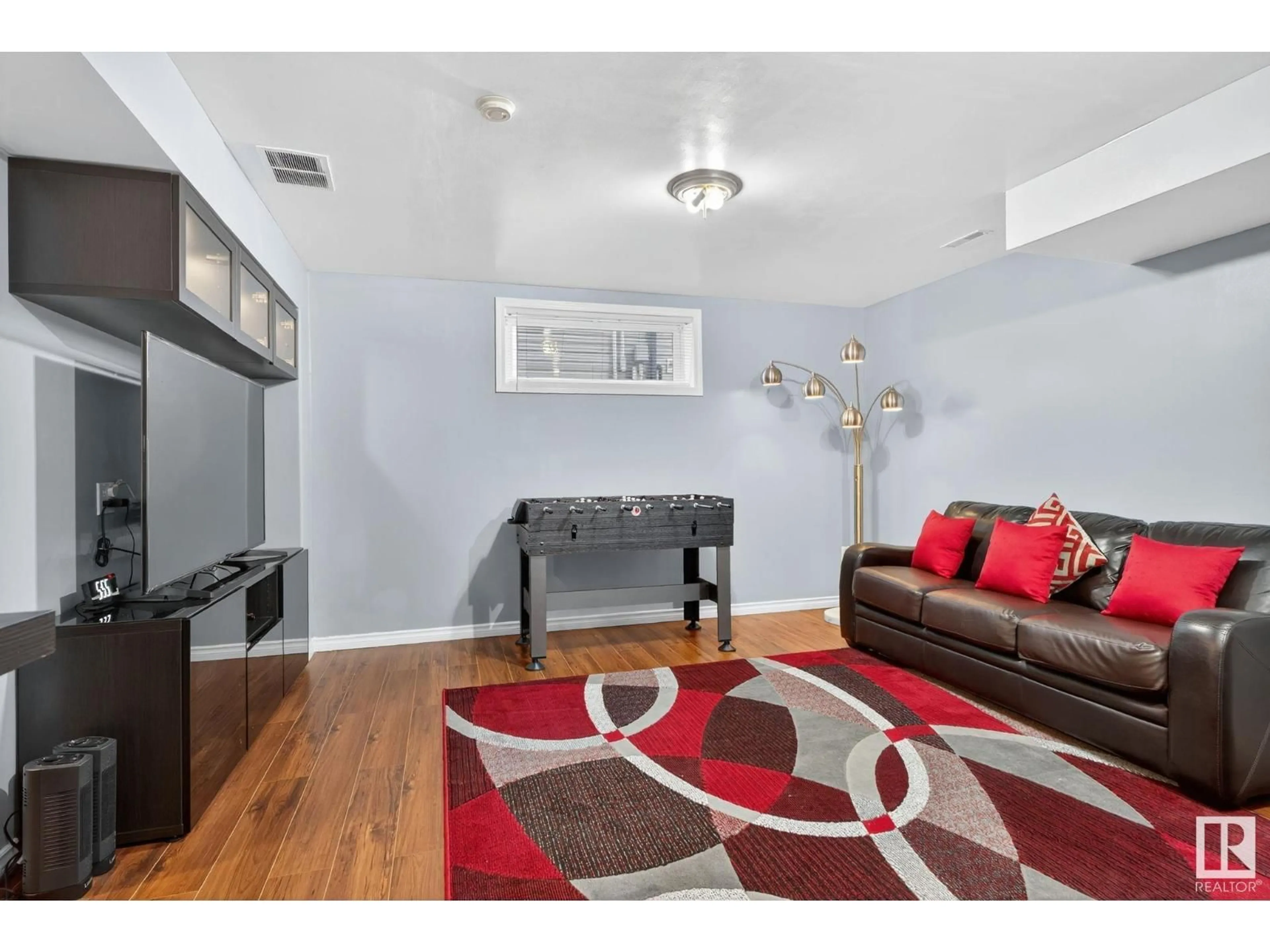 Living room with furniture, wood/laminate floor for 38 BIRCHGLEN CR, Leduc Alberta T9E0C5
