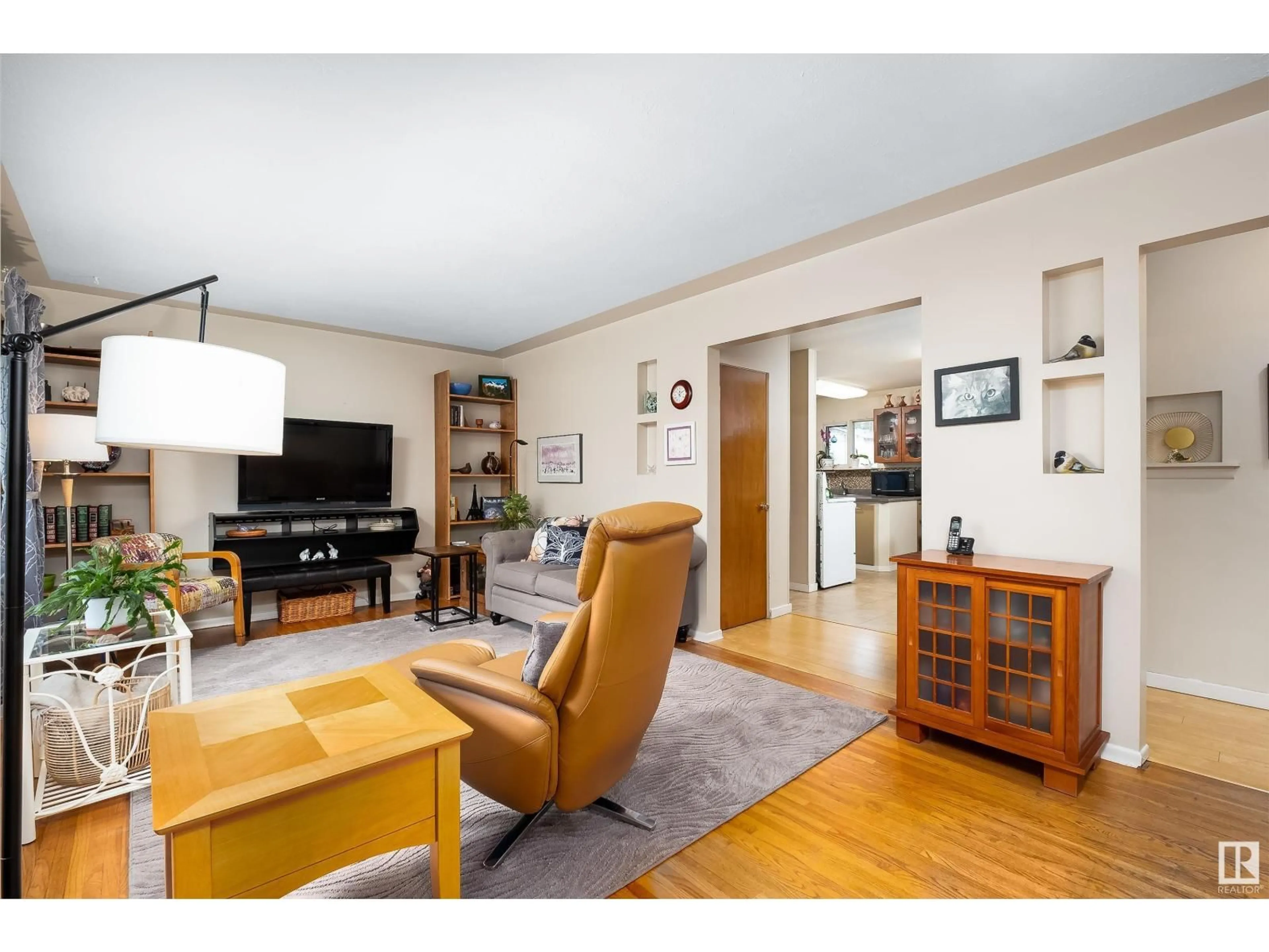 Living room with furniture, wood/laminate floor for NW - 13120 63 ST, Edmonton Alberta T5A0W8