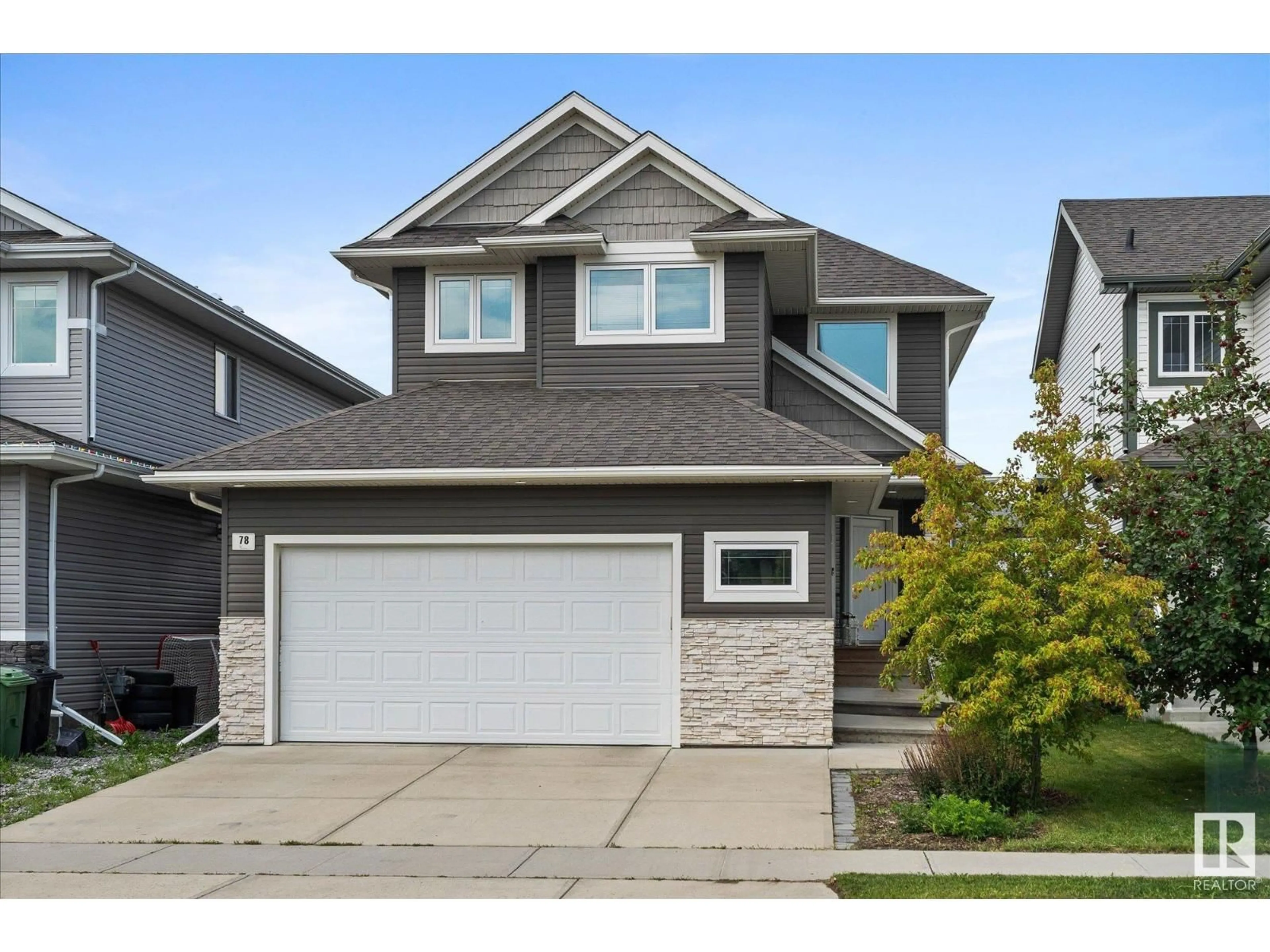 Home with vinyl exterior material, street for 78 WOODHILL LN, Fort Saskatchewan Alberta T8L0J9