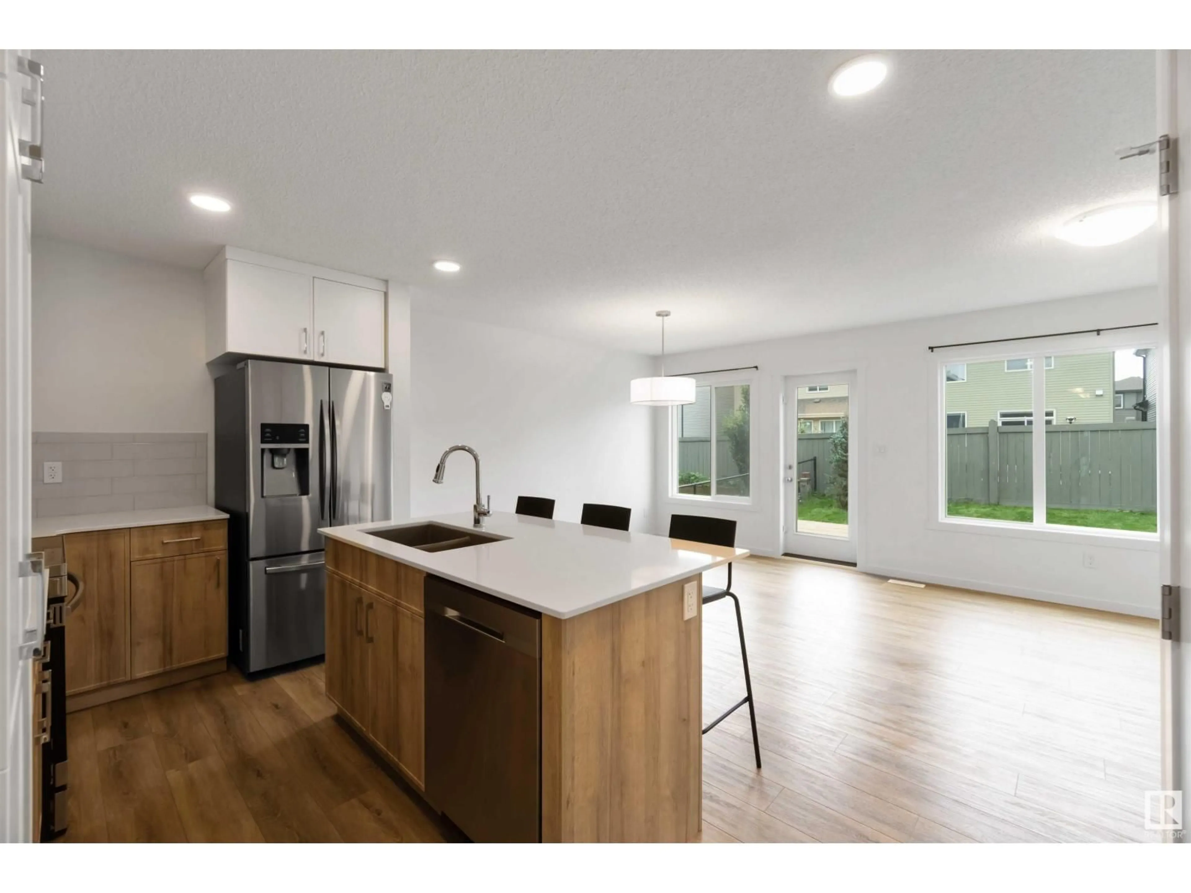 Open concept kitchen, wood/laminate floor for #3 - 13119 209 ST NW, Edmonton Alberta T5S0P4