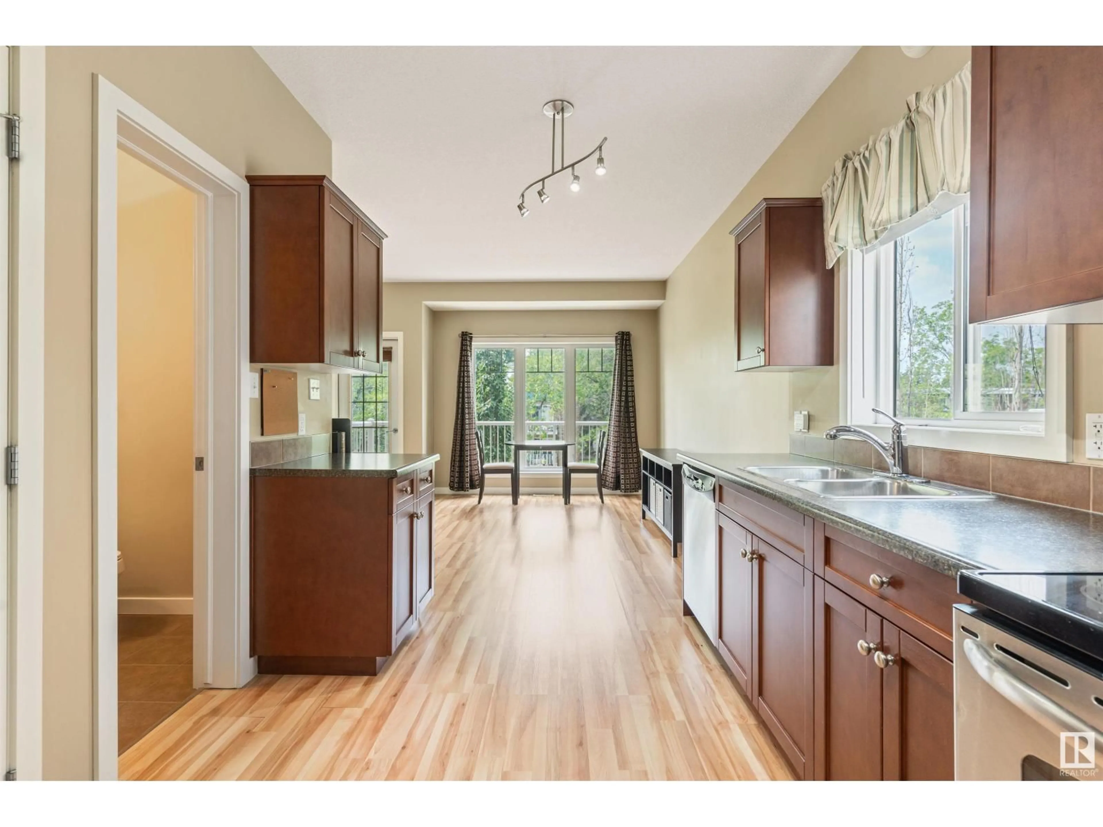 Open concept kitchen, wood/laminate floor for #6 - 11913 103 ST NW, Edmonton Alberta T5G2J4