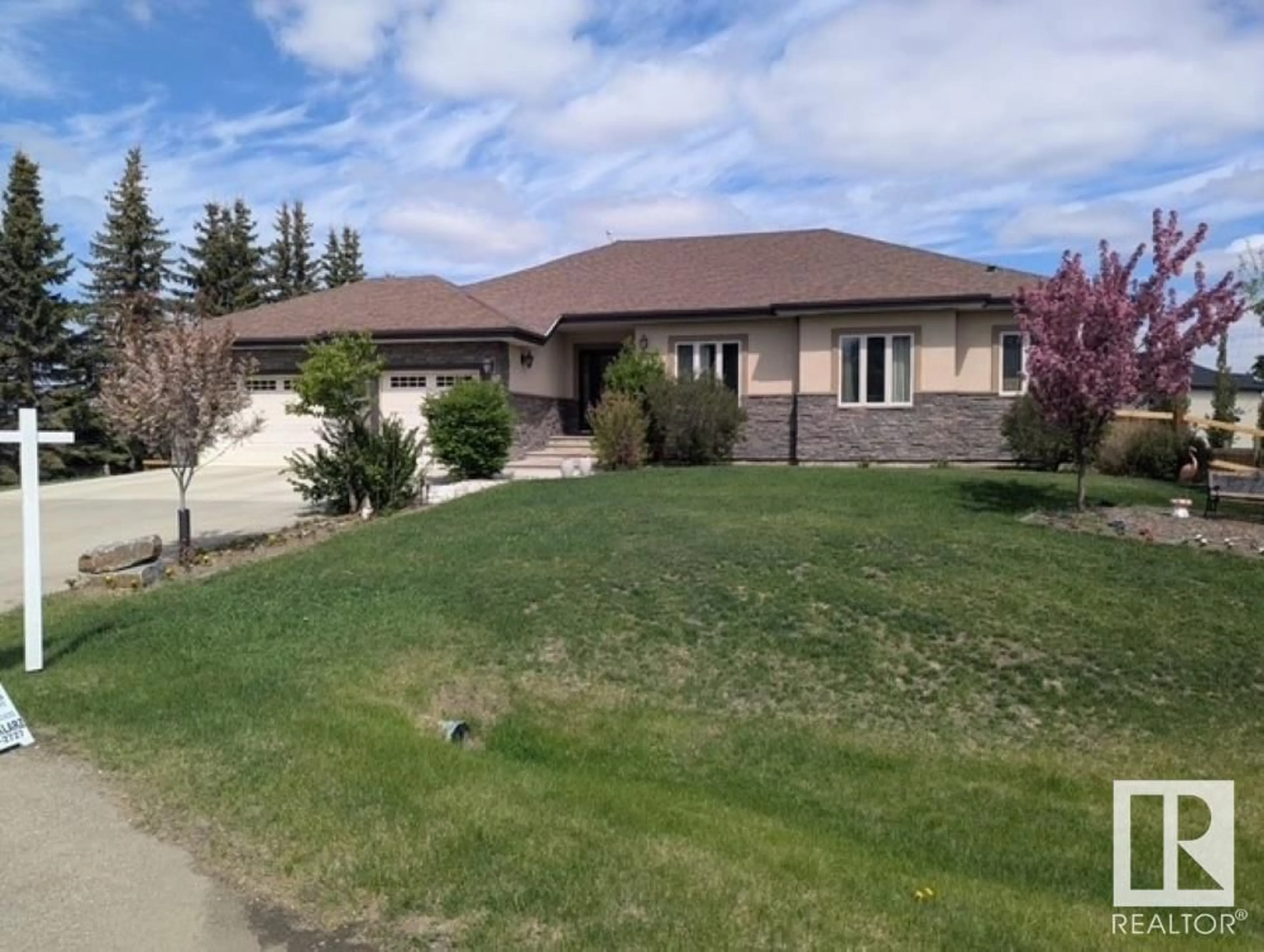A pic from outside/outdoor area/front of a property/back of a property/a pic from drone, street for 26116A HWY 16, Rural Parkland County Alberta T7Y1A1