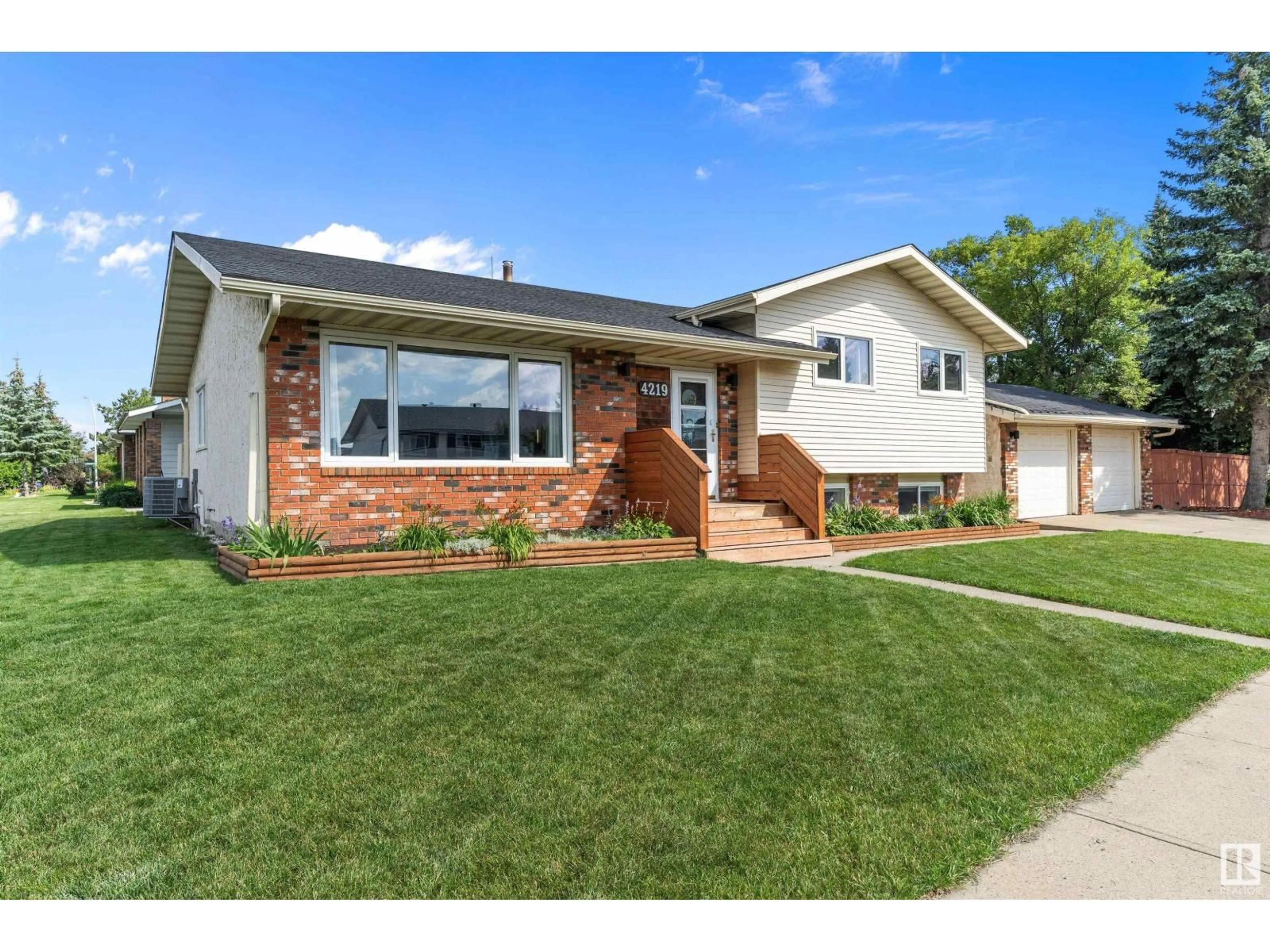 Home with vinyl exterior material, street for 4219 86 ST, Edmonton Alberta T6K1E4