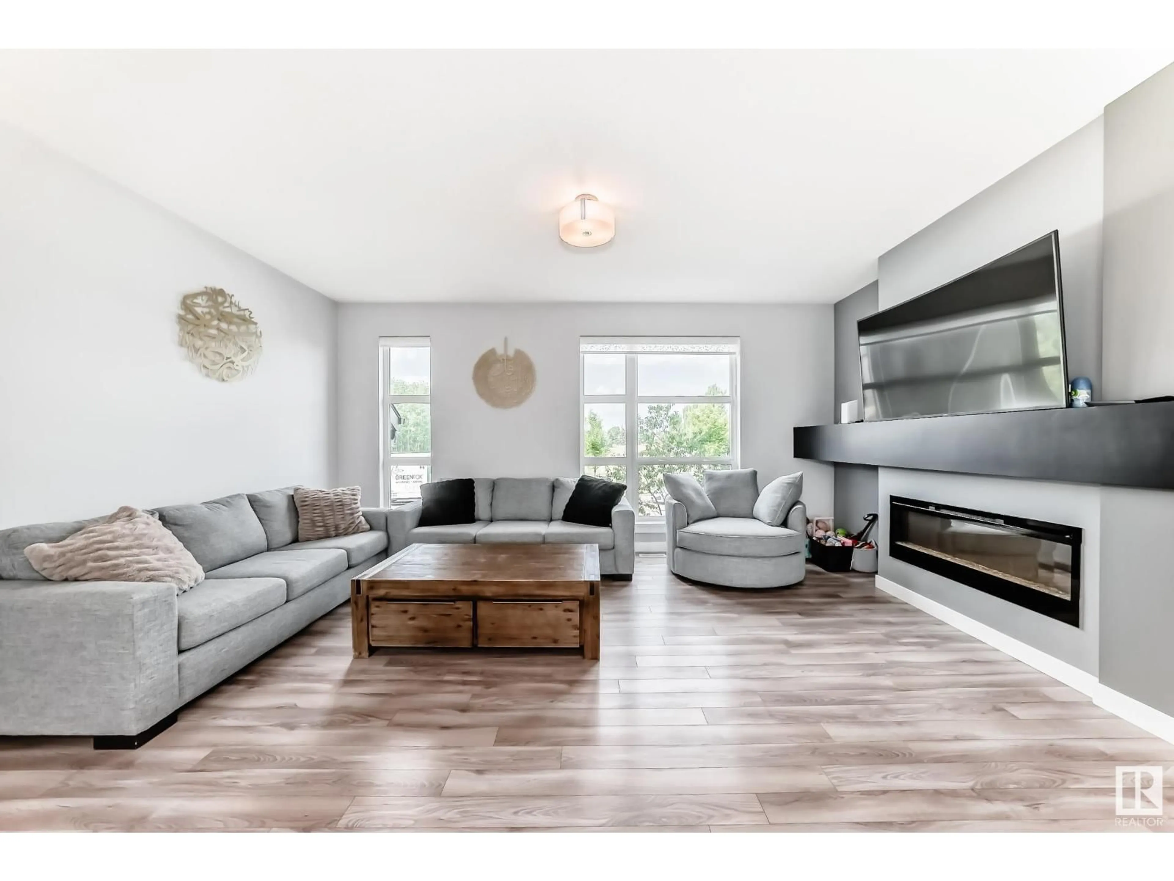 Living room with furniture, wood/laminate floor for 14723 125 ST, Edmonton Alberta T5X0G8