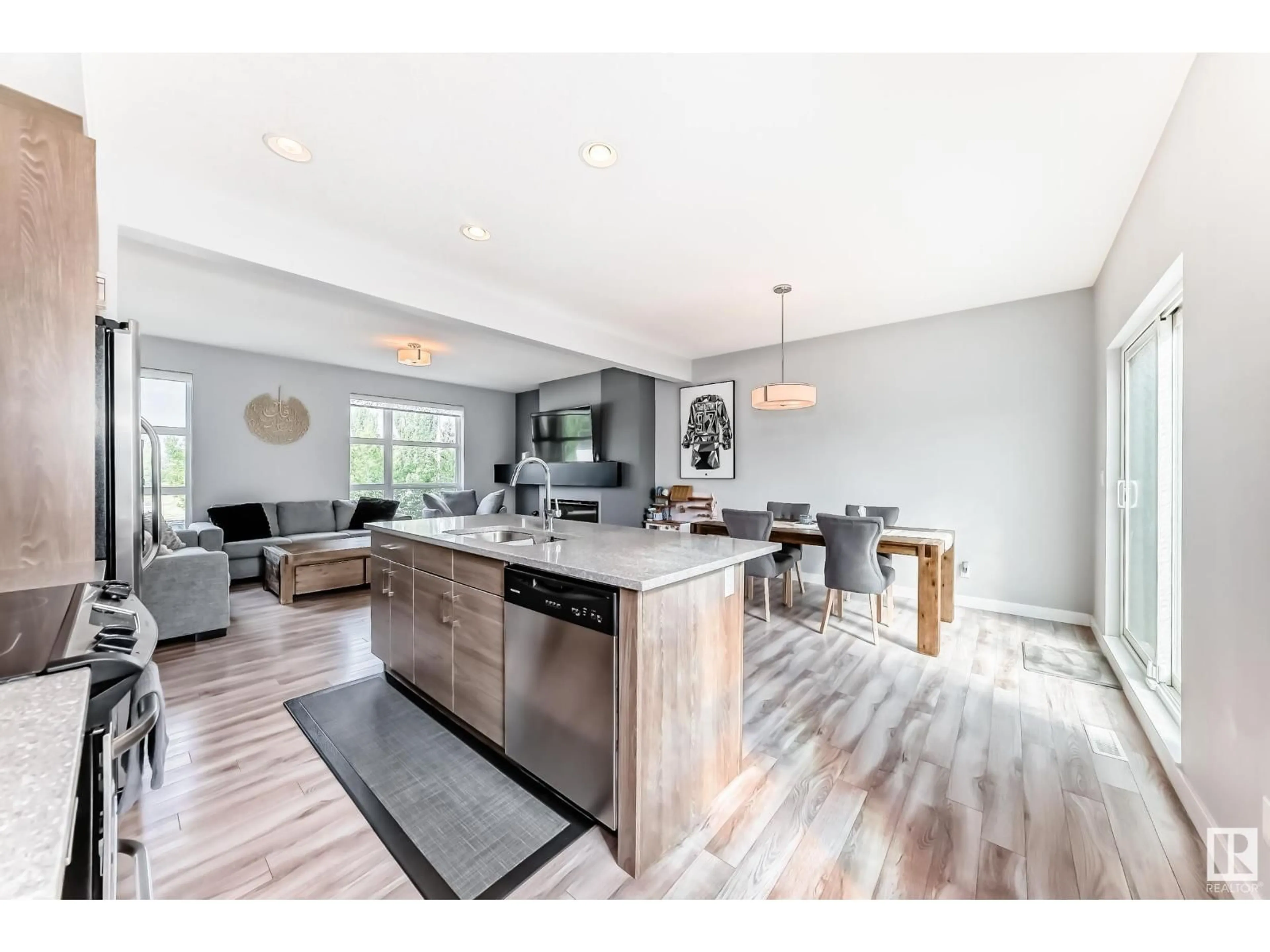 Open concept kitchen, wood/laminate floor for 14723 125 ST, Edmonton Alberta T5X0G8