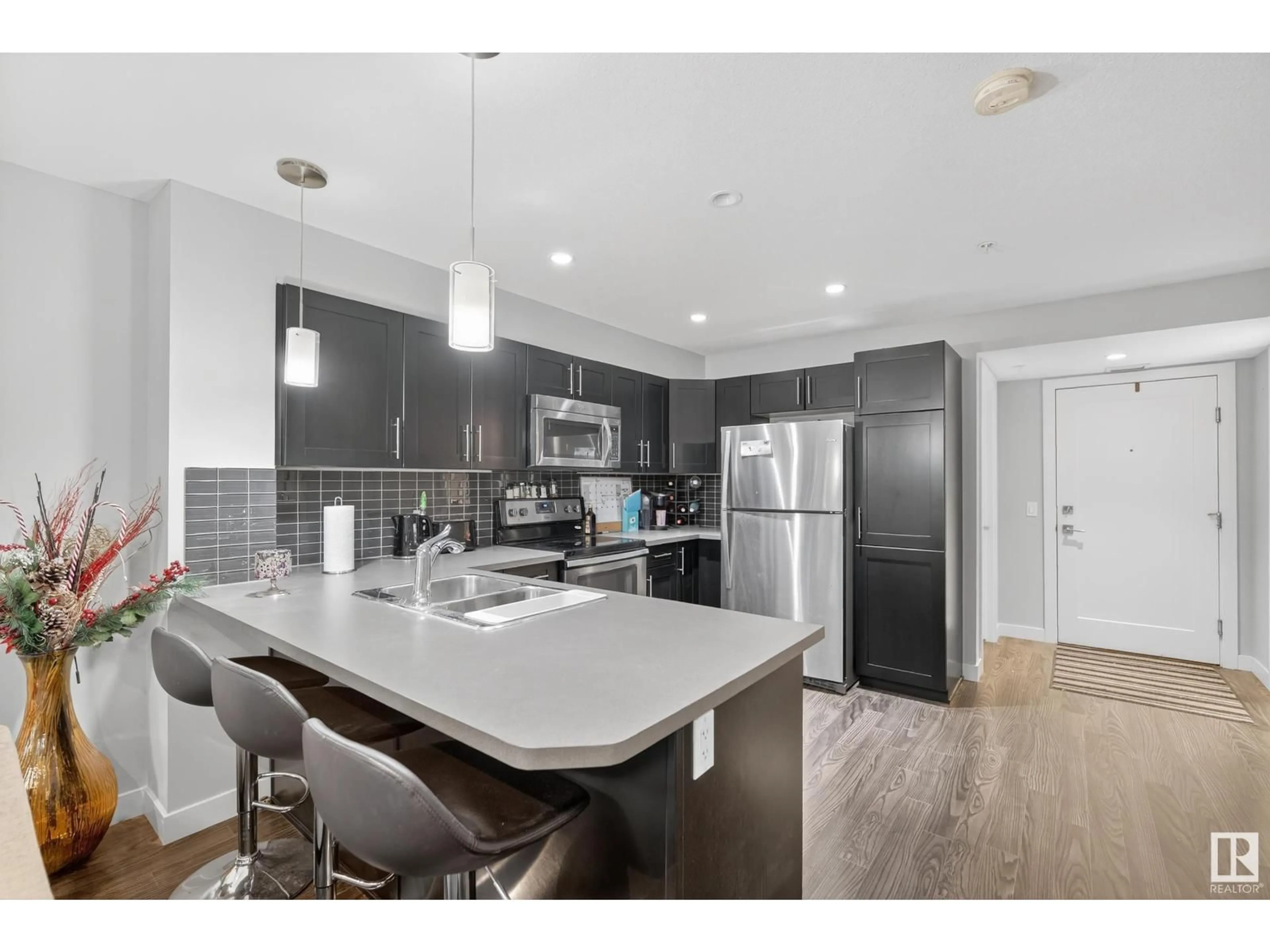 Open concept kitchen, unknown for #107 - 1031 173 ST, Edmonton Alberta T6W3E4