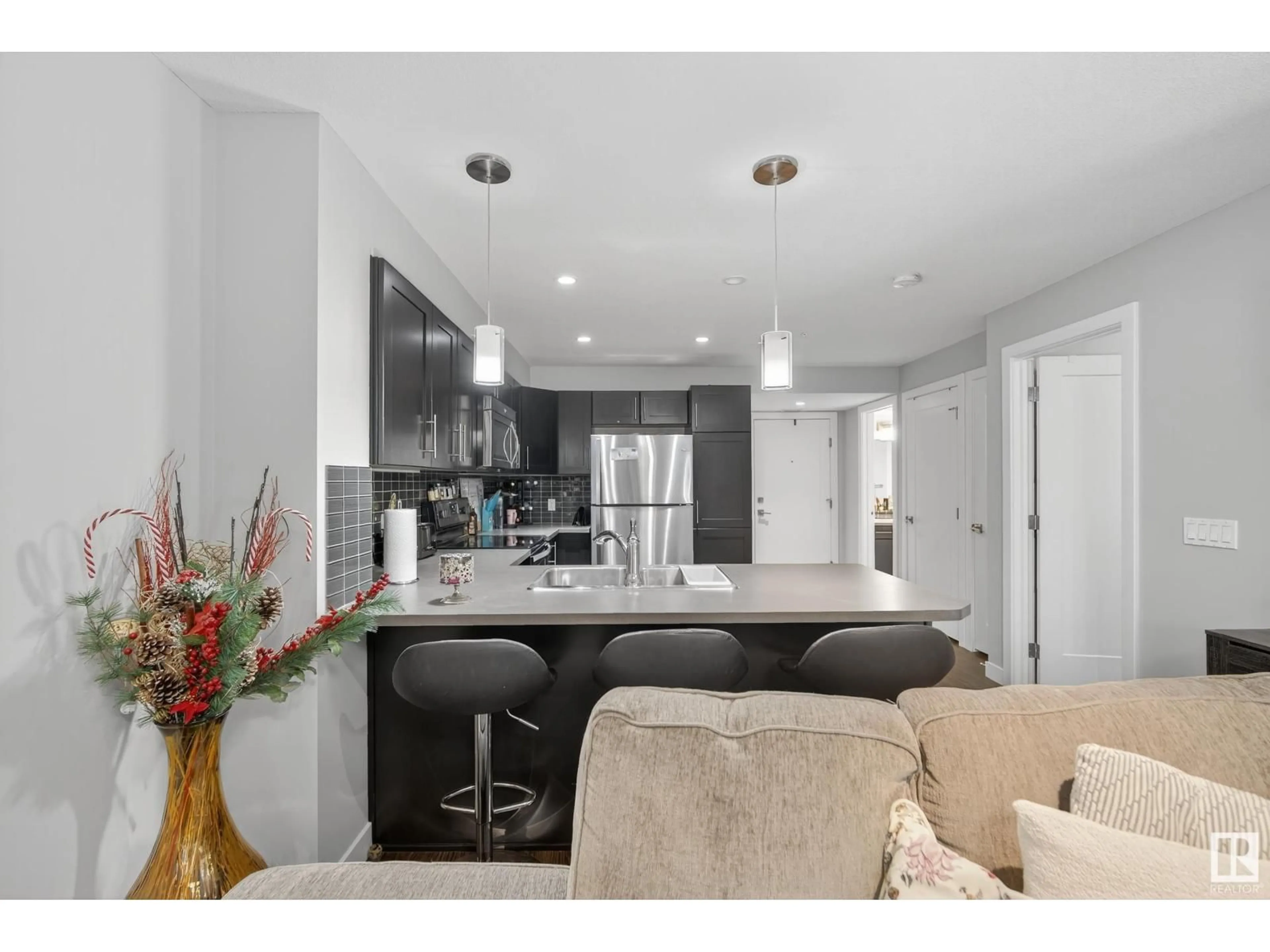 Open concept kitchen, unknown for #107 - 1031 173 ST, Edmonton Alberta T6W3E4