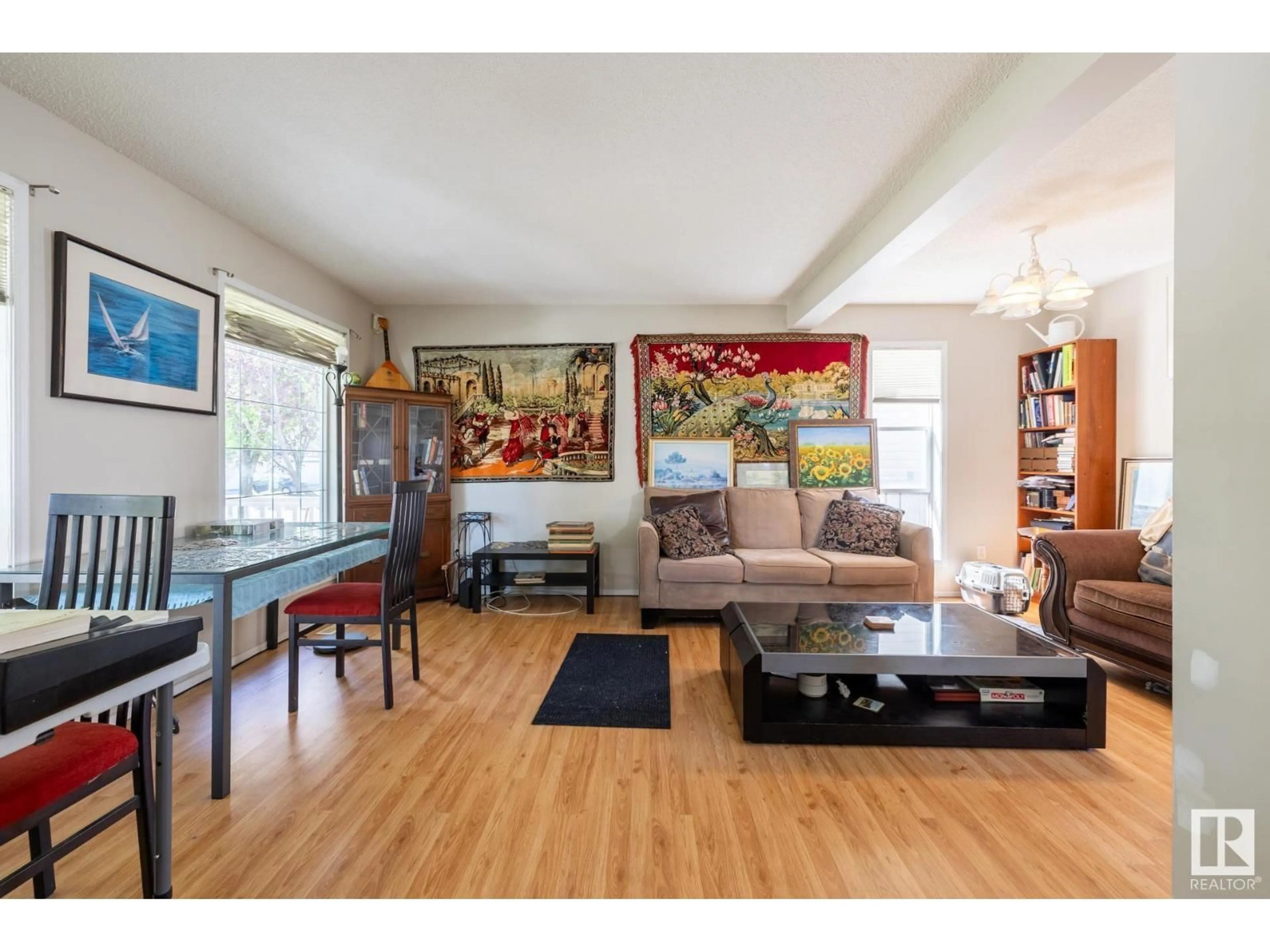 Living room with furniture, wood/laminate floor for NW - 5228 201 ST, Edmonton Alberta T6M2W2