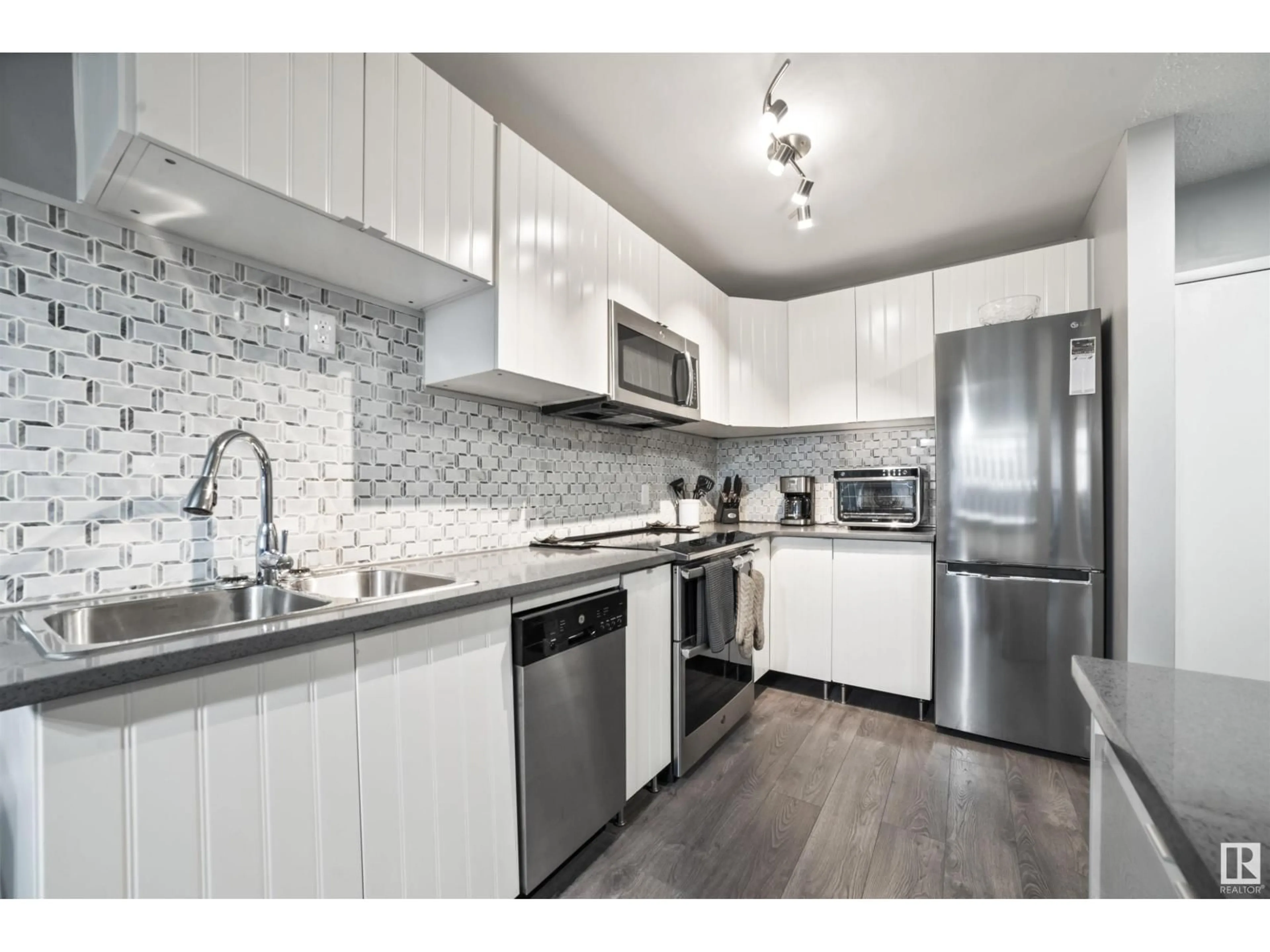 Open concept kitchen, unknown for #106 - 14908 26 ST, Edmonton Alberta T5Y2G4