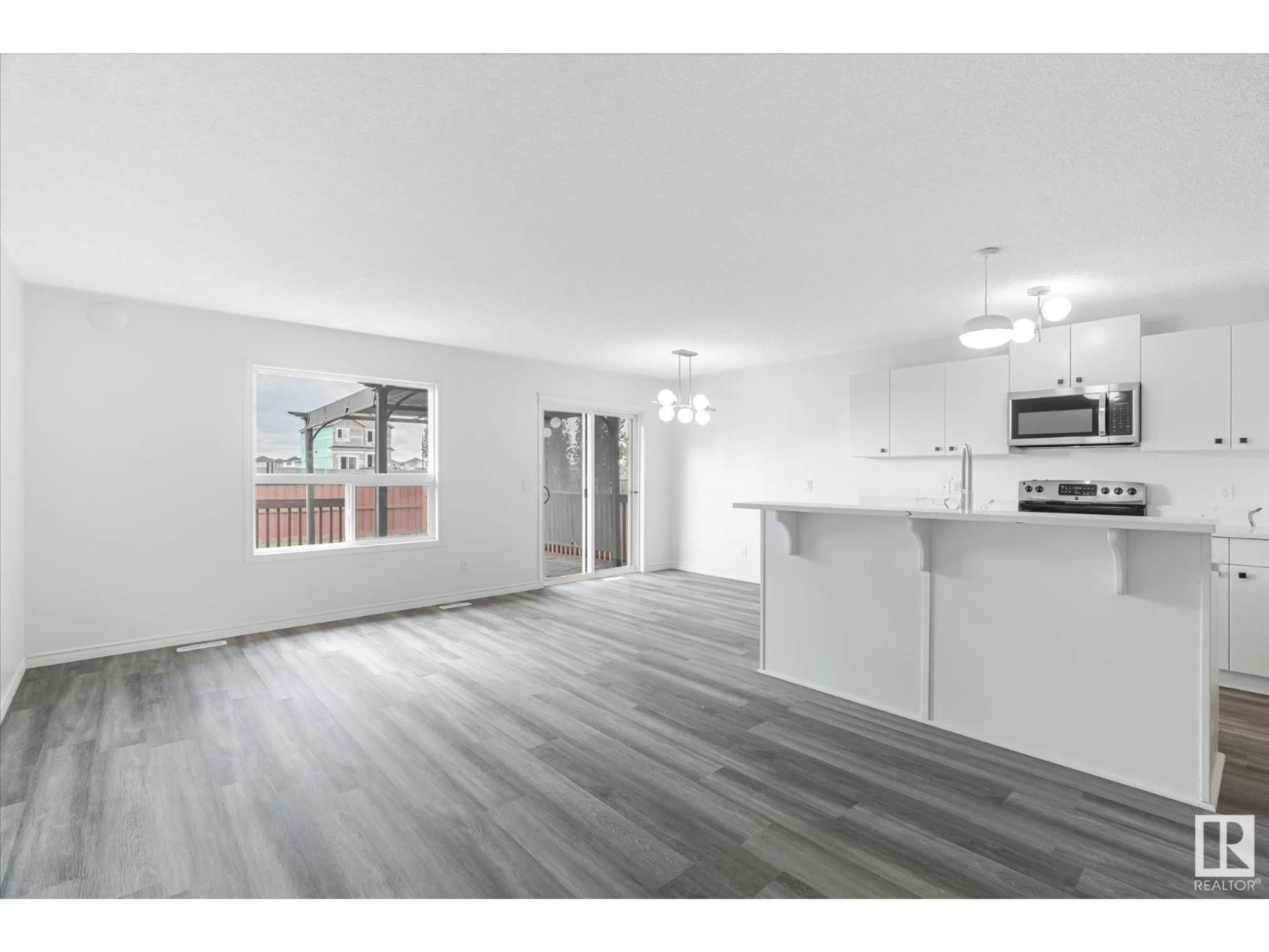 Open concept kitchen, wood/laminate floor for 42 CATALINA CO, Fort Saskatchewan Alberta T8L0K5