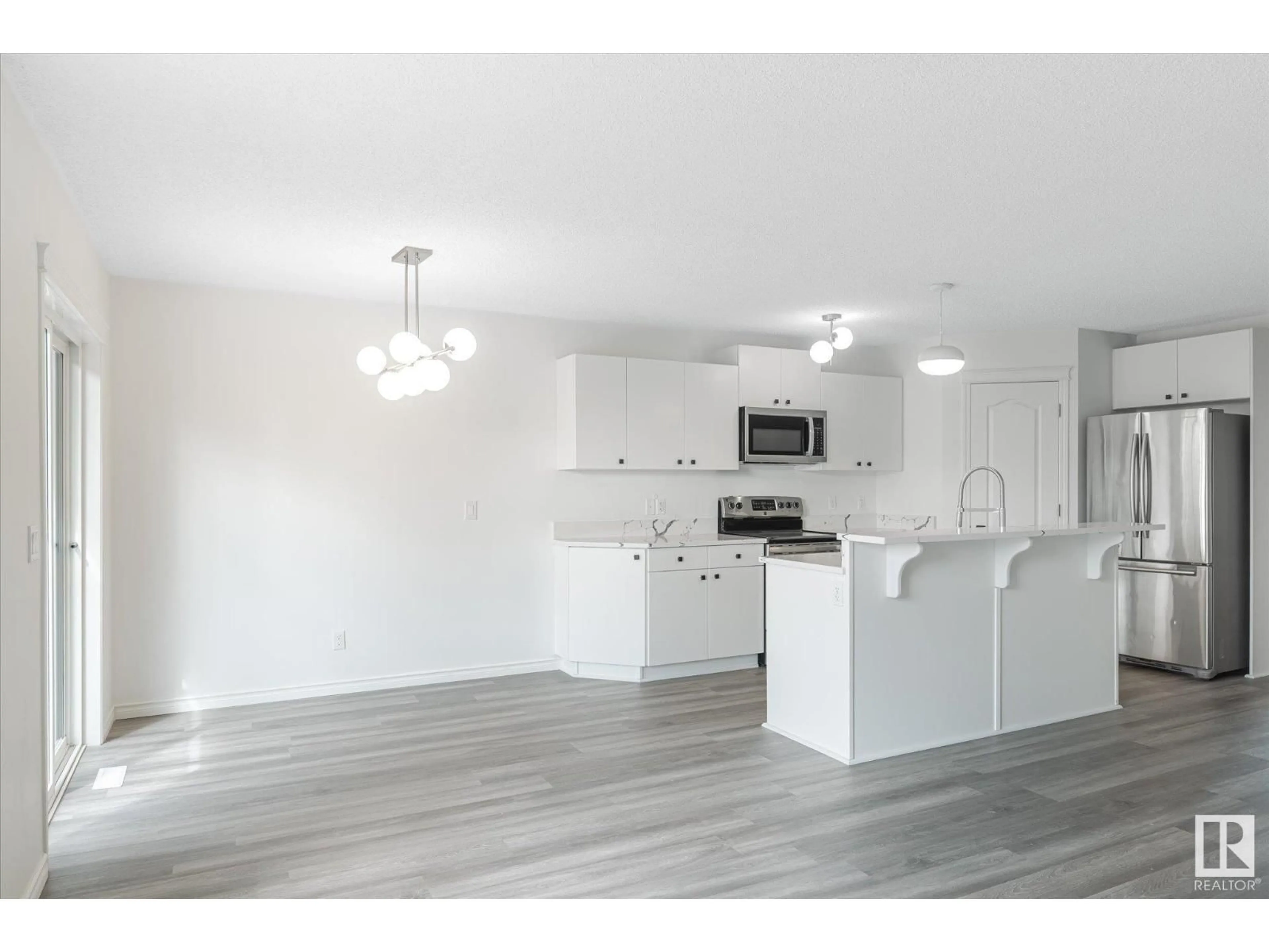 Open concept kitchen, wood/laminate floor for 42 CATALINA CO, Fort Saskatchewan Alberta T8L0K5