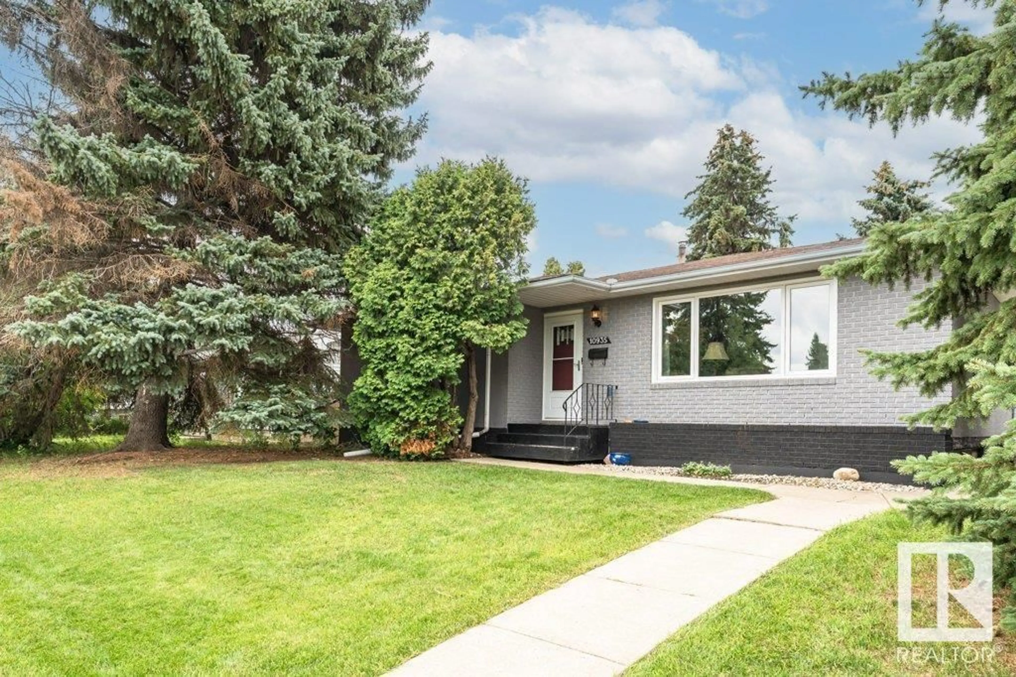 Home with vinyl exterior material, street for 10935 37 AV, Edmonton Alberta T6J0G8