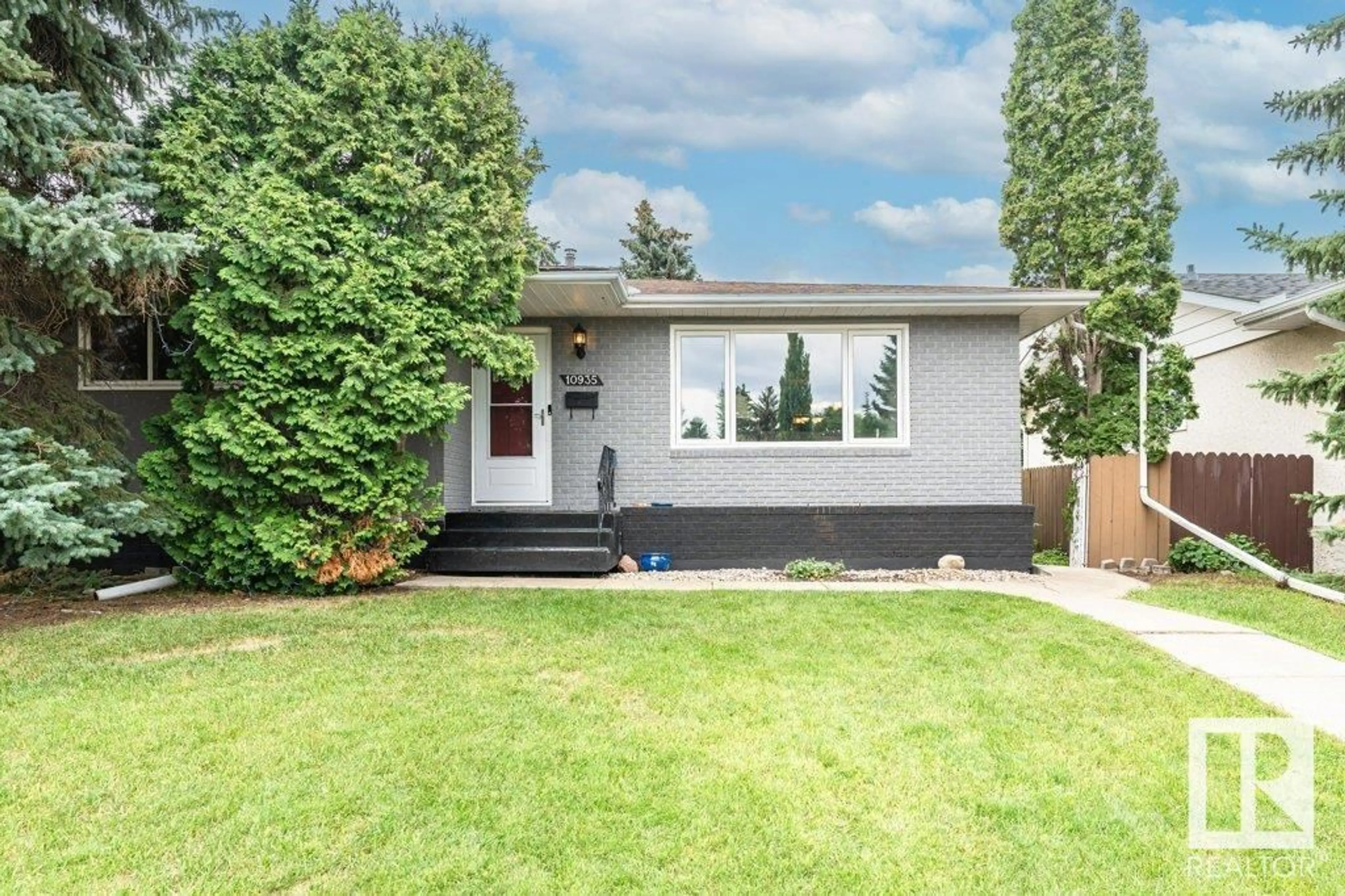 Home with vinyl exterior material, street for 10935 37 AV, Edmonton Alberta T6J0G8