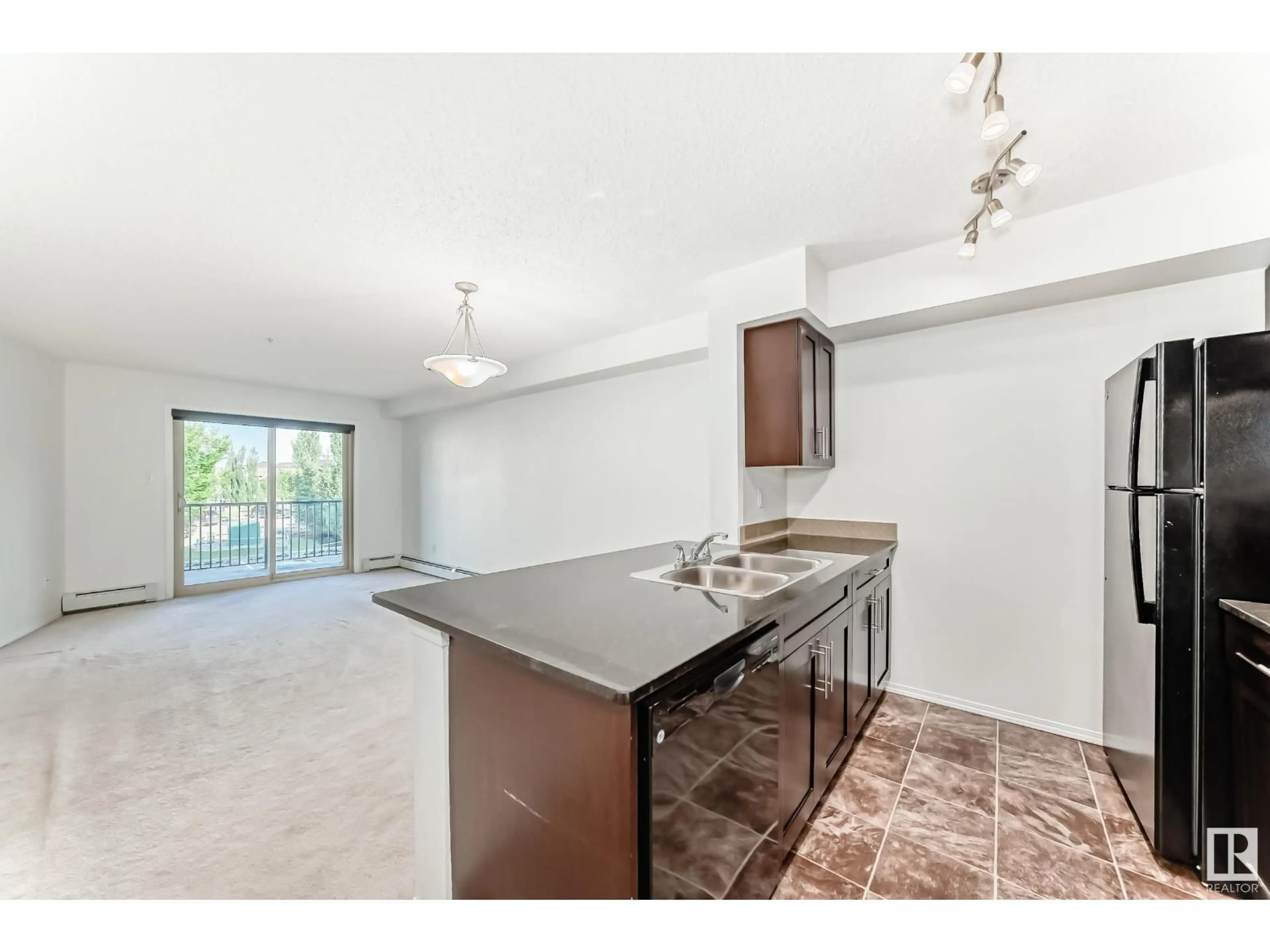 Open concept kitchen, unknown for #222 - 274 MCCONACHIE DR, Edmonton Alberta T5Y3N4