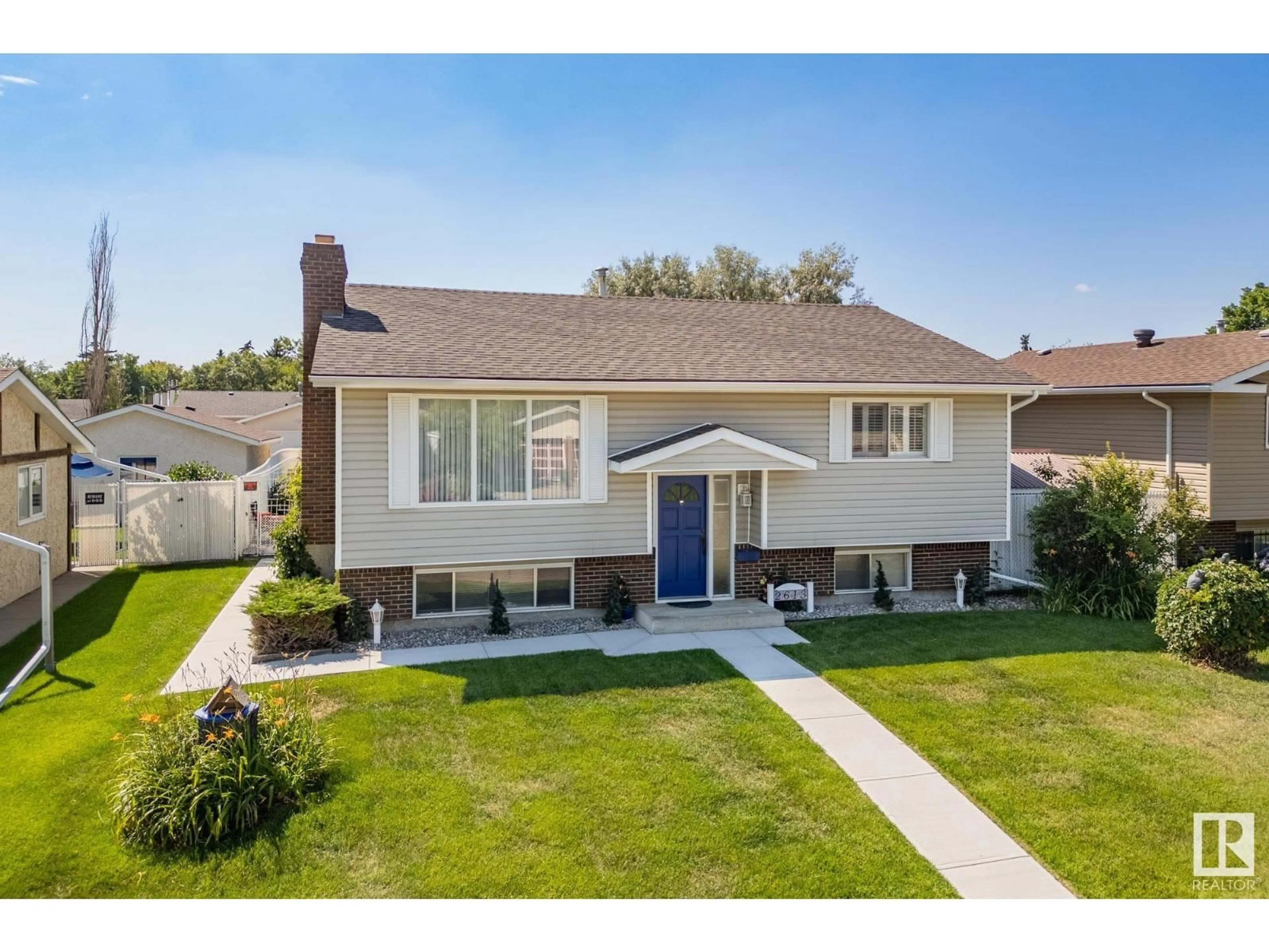 Home with vinyl exterior material, street for 2613 135A AV, Edmonton Alberta T5A3W9