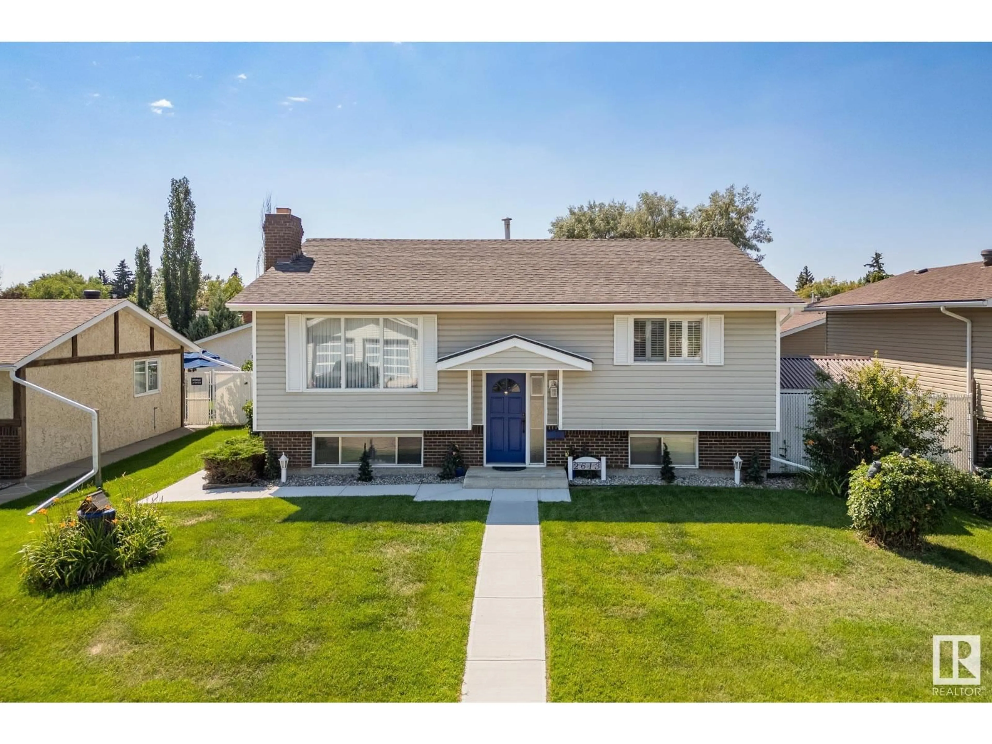Home with vinyl exterior material, street for 2613 135A AV, Edmonton Alberta T5A3W9