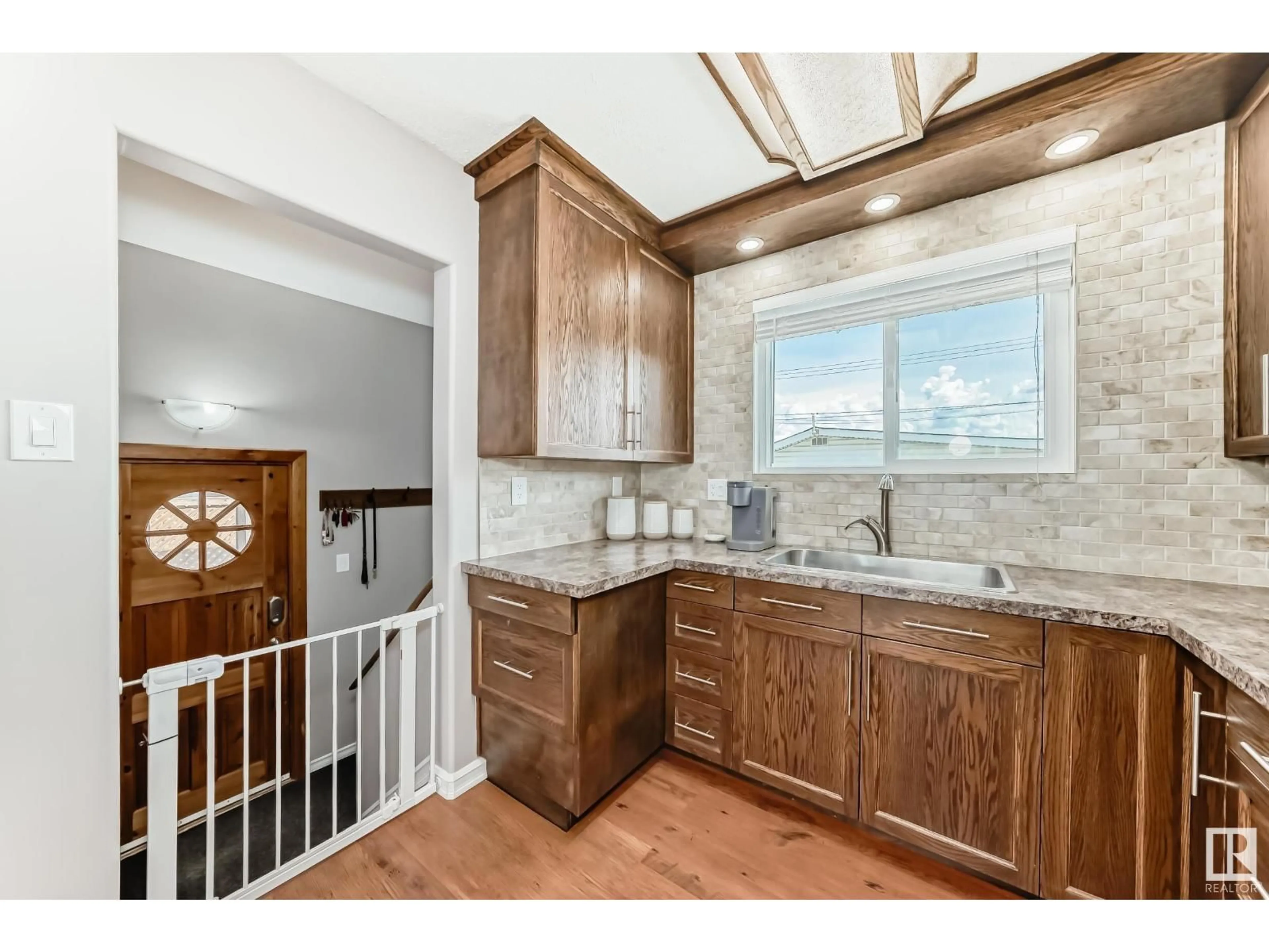 Open concept kitchen, ceramic/tile floor for 8511 70 ST, Edmonton Alberta T6B1W6