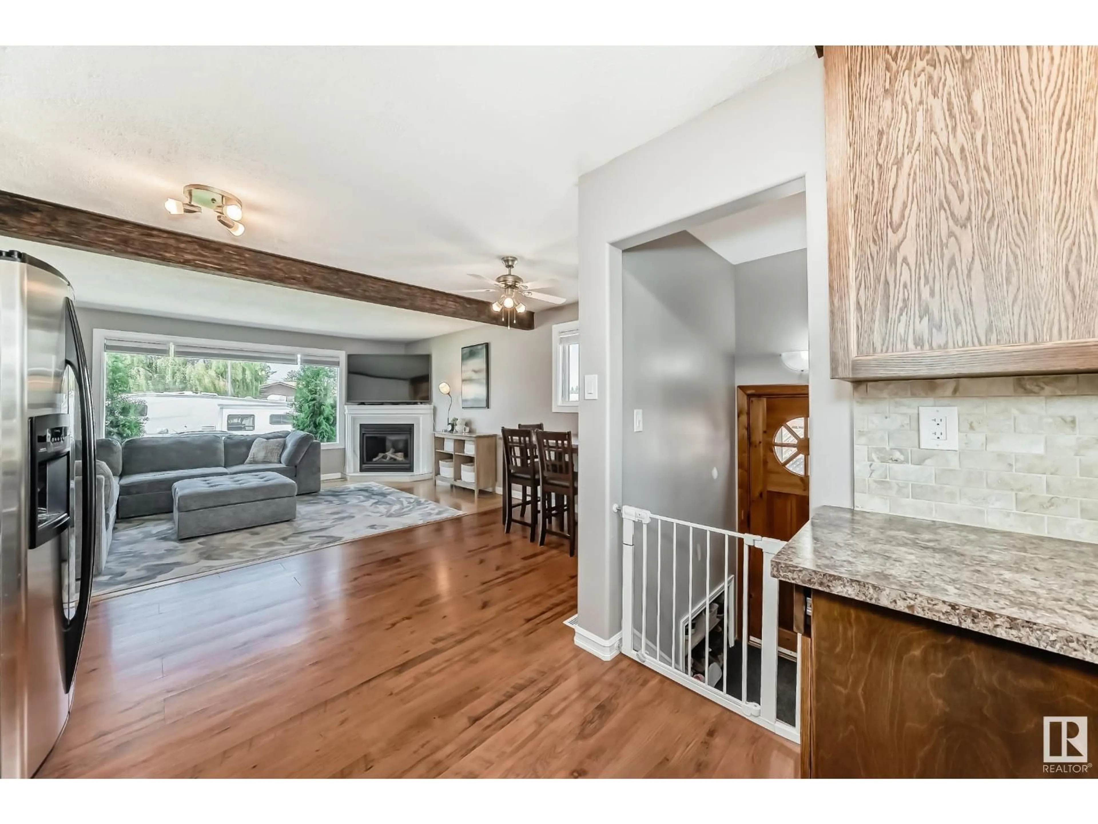 Open concept kitchen, wood/laminate floor for 8511 70 ST, Edmonton Alberta T6B1W6