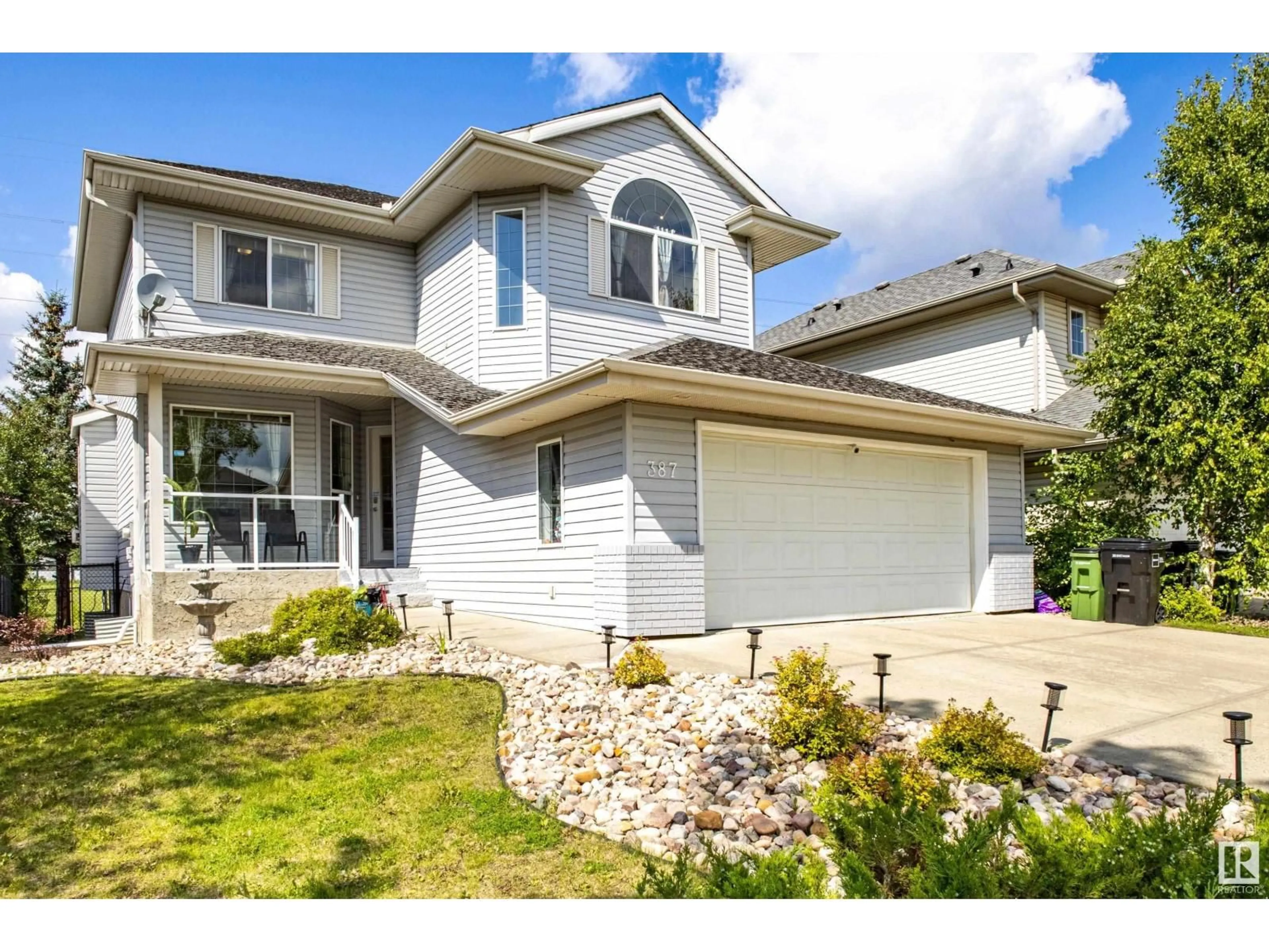 Home with vinyl exterior material, street for 387 HEATH RD, Edmonton Alberta T6R2T8