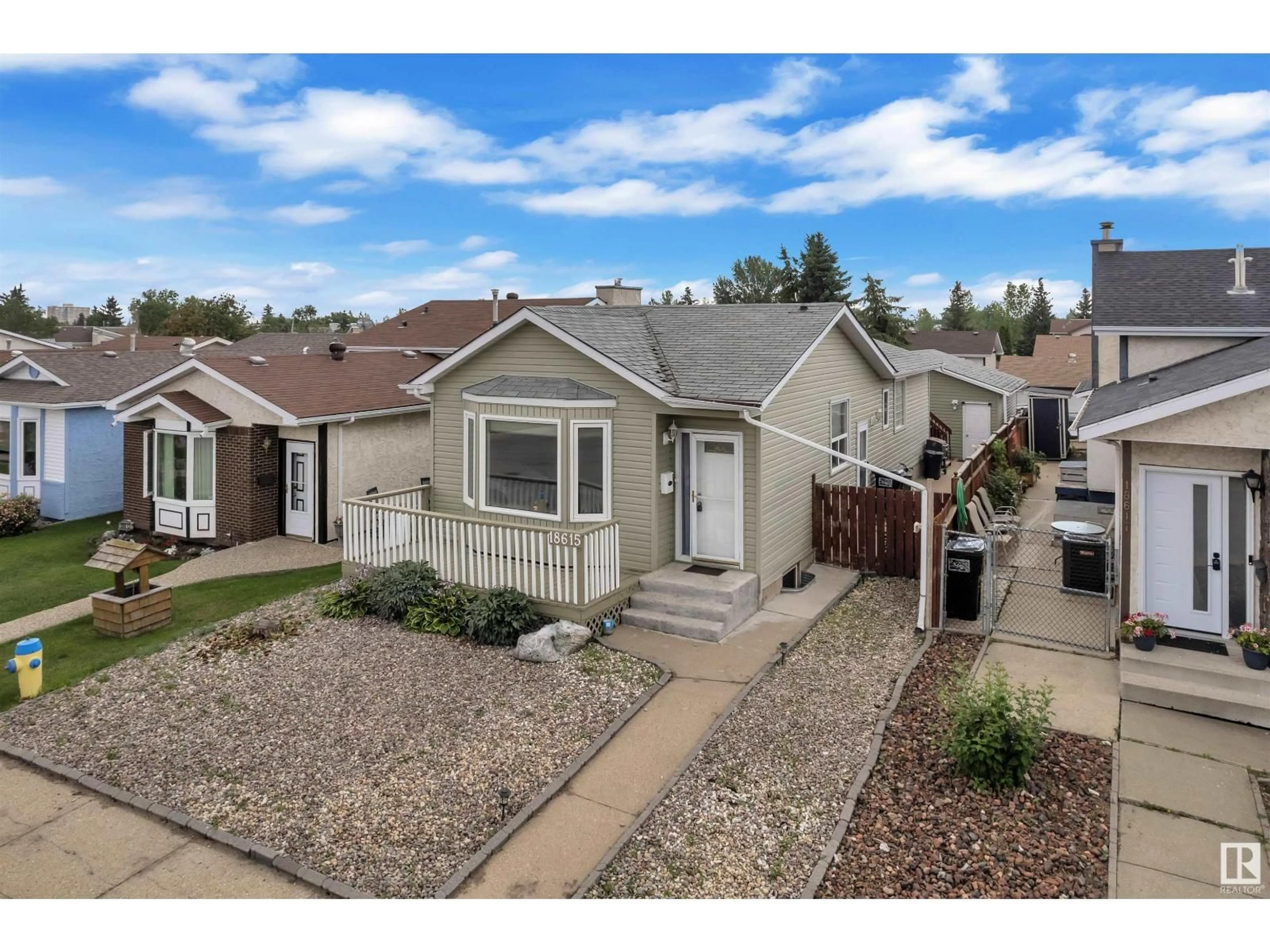Home with vinyl exterior material, street for 18615 75 AV, Edmonton Alberta T5T5J9