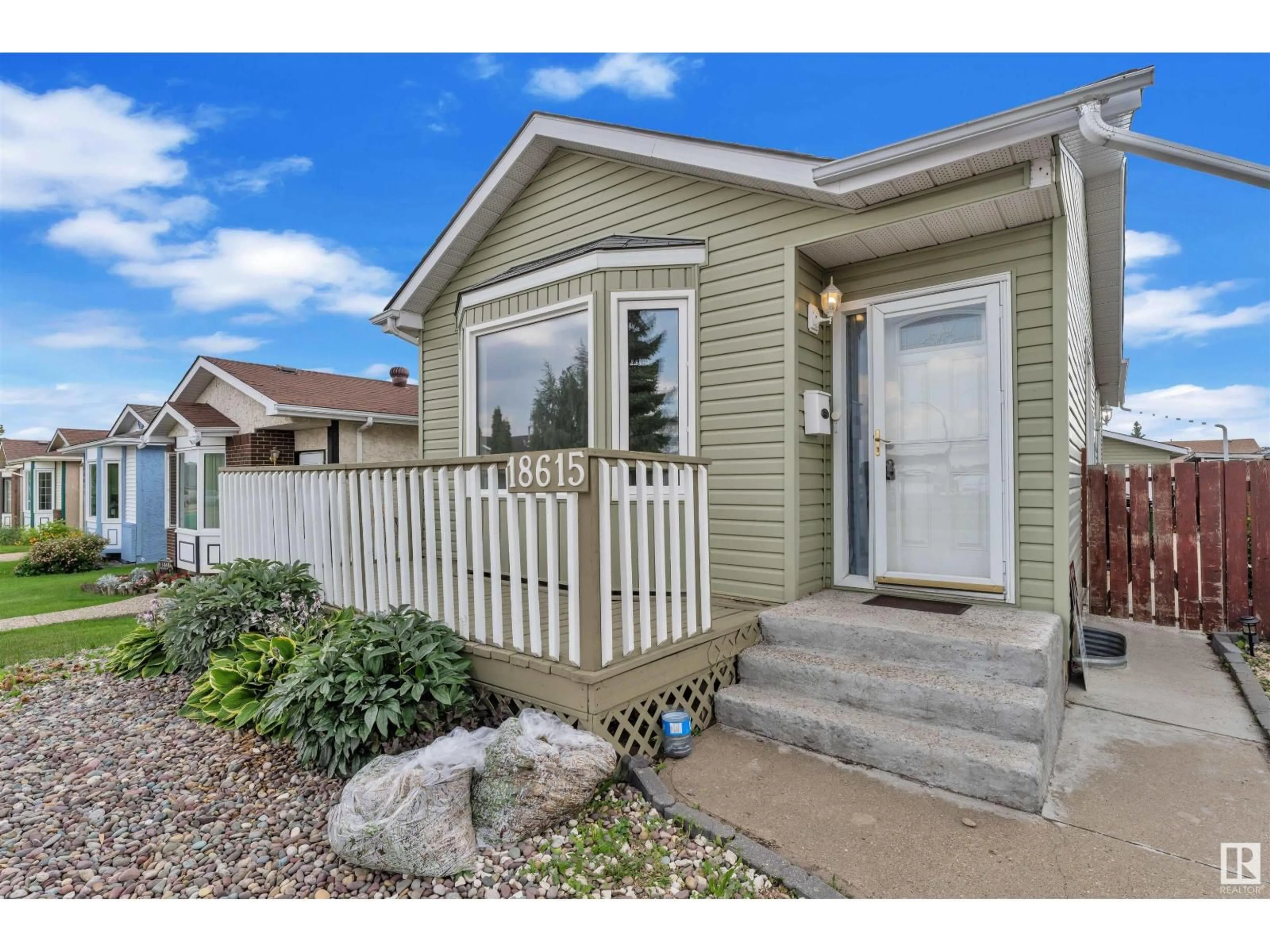 Home with vinyl exterior material, street for 18615 75 AV, Edmonton Alberta T5T5J9